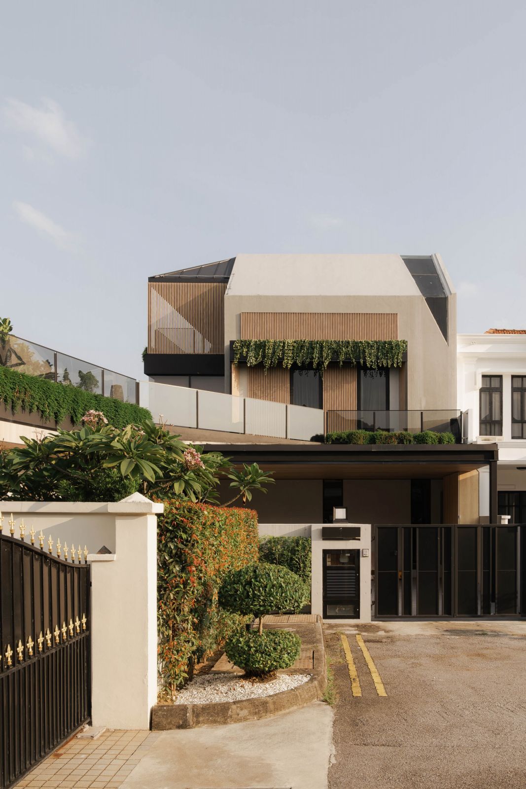 This corner terrace house in Yio Chu Kang by Create Architecture embraces the home’s history and verdant surroundings with a beautifully resolved hanging garden concept
