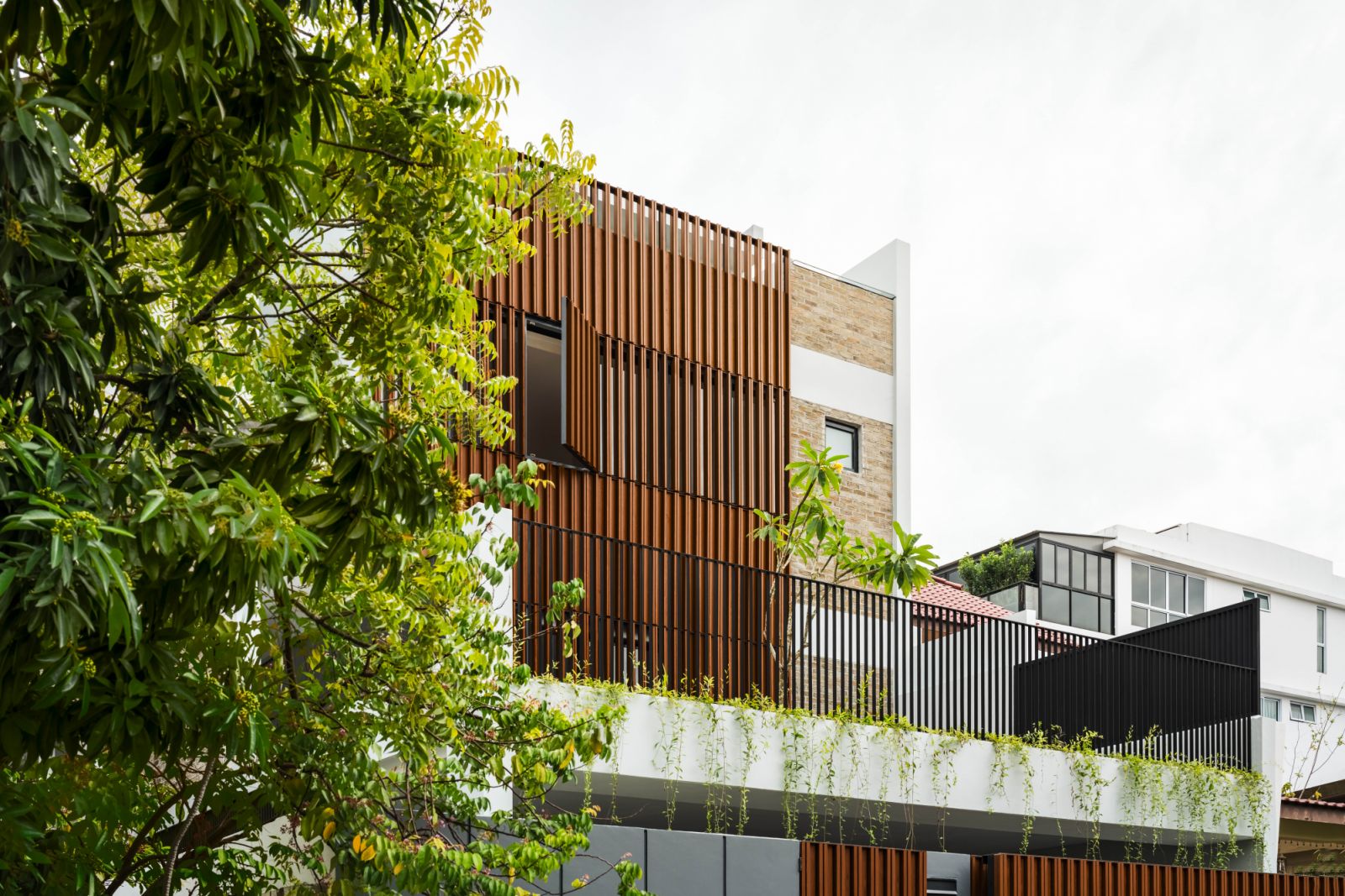 Designed by Create Architecture, this semi-detached home in Singapore’s District 15 integrates greenery and light for a serene family retreat that offers greater functional flexibility