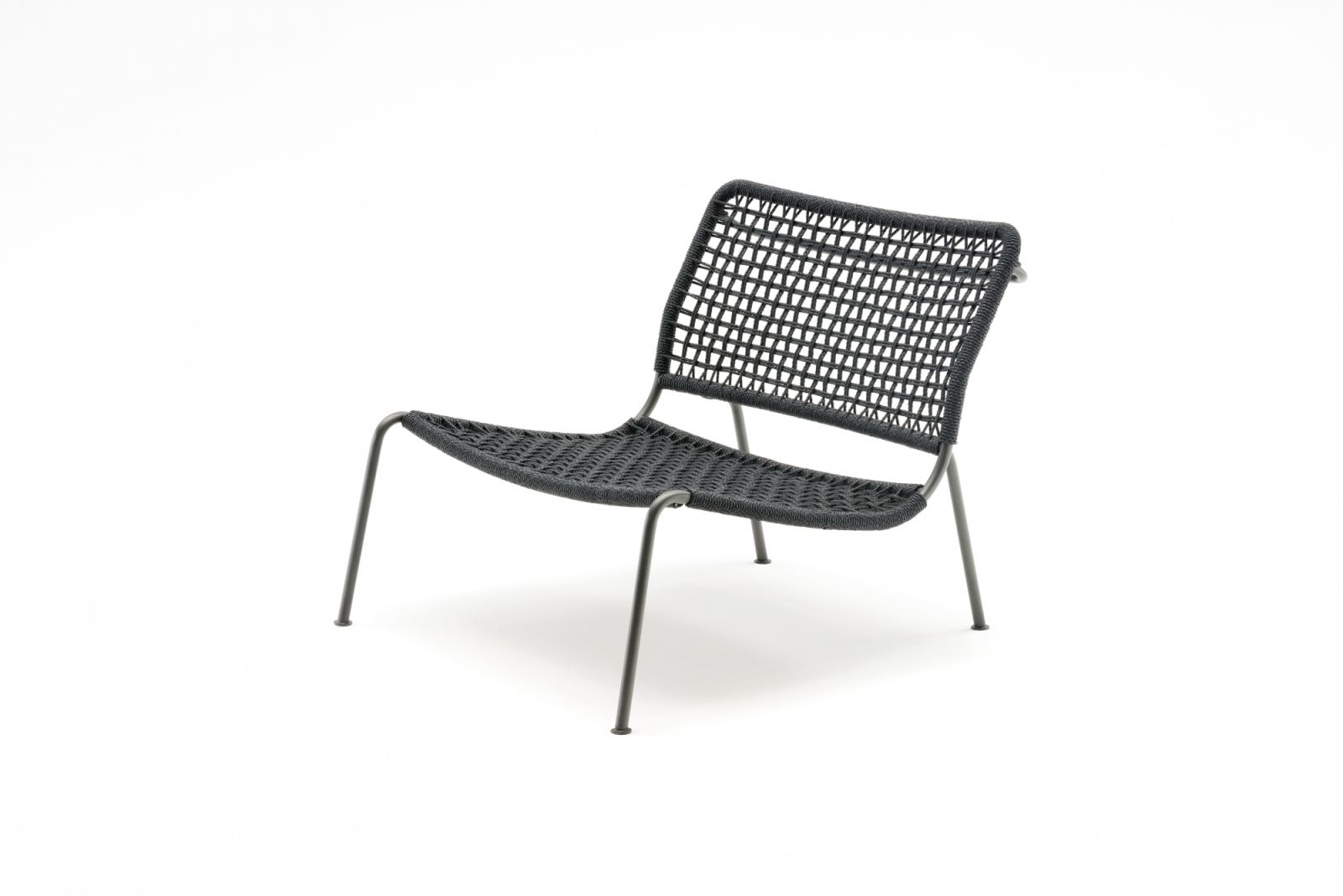 The Living Divani Frog Chair by Piero Lissoni is a masterful study in restrained elegance, with a deliberately low profile that offers visual lightness despite its substantial comfort.