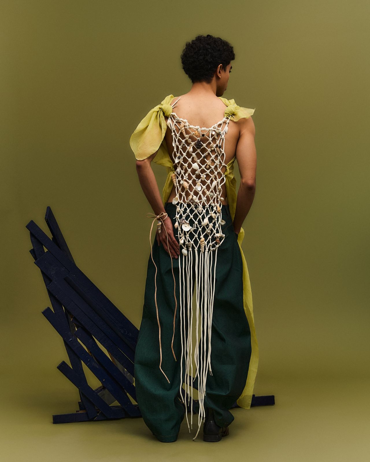 A look from Kelvin Morales’s ‘Pirate Bae’ collection featuring a yellow top with shell details on (Photo: Courtesy of Kelvin Morales)