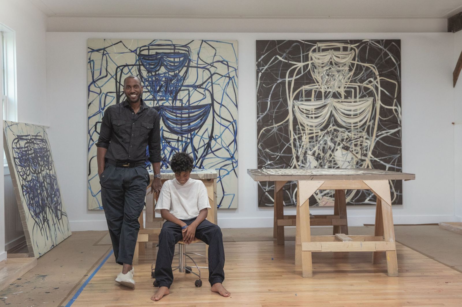Rashid Johnson and his son in his studio in Amagansett, New York