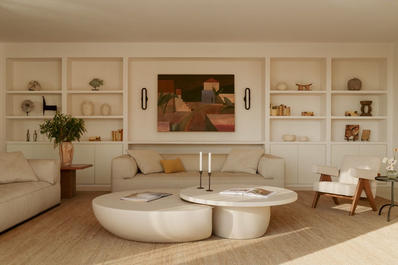 The main living area’s built-in storage and seating demonstrate Tom Lawrence-Levy’s approach to creating bespoke solutions, with the signature custom coffee table anchoring the space