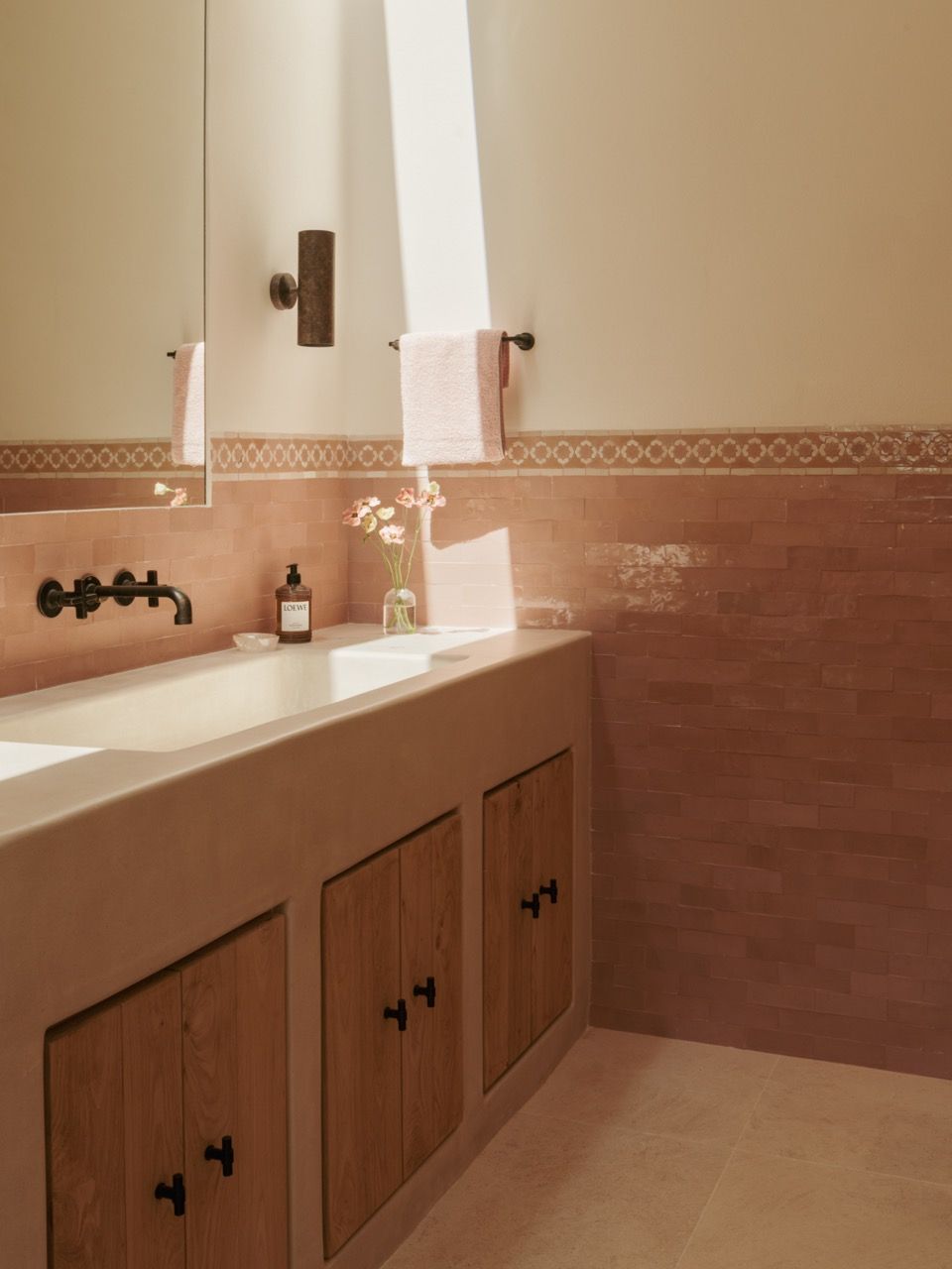Traditional Moroccan zellige tiles in terracotta tones reference the region’s historical connections whilst being seamlessly integrated into the contemporary bathroom design