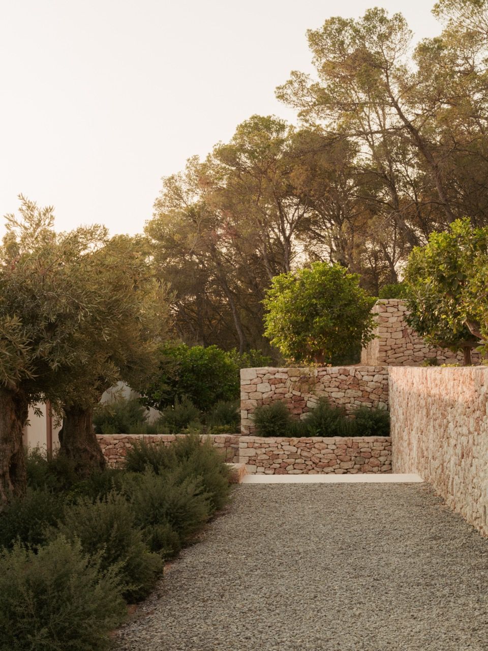 The hillside setting, surrounded by native vegetation, provides the perfect backdrop for this reinterpretation of Ibiza’s traditional finca style