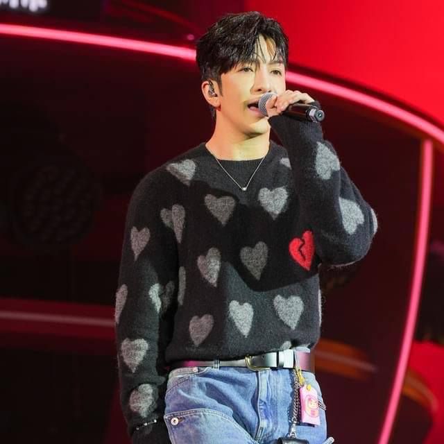 Anson Lo at fan meeting wearing AllSaints heart sweater