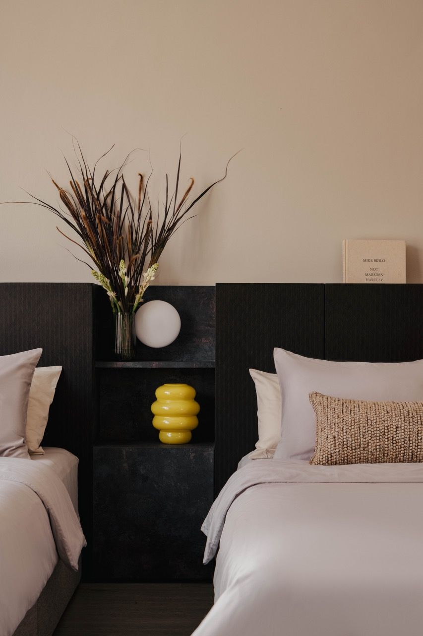 Built-in shelving with decorative objects, showing how the natural veneer provides a backdrop for the gradually collected decor items