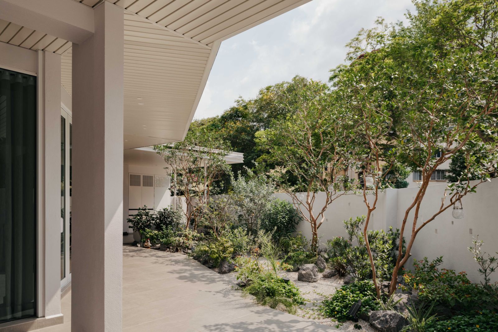 Landscaped garden area showing the curated outdoor spaces that were designed to encourage a stronger connection with nature from within the interior, enhancing the overall sense of calm and well-being
