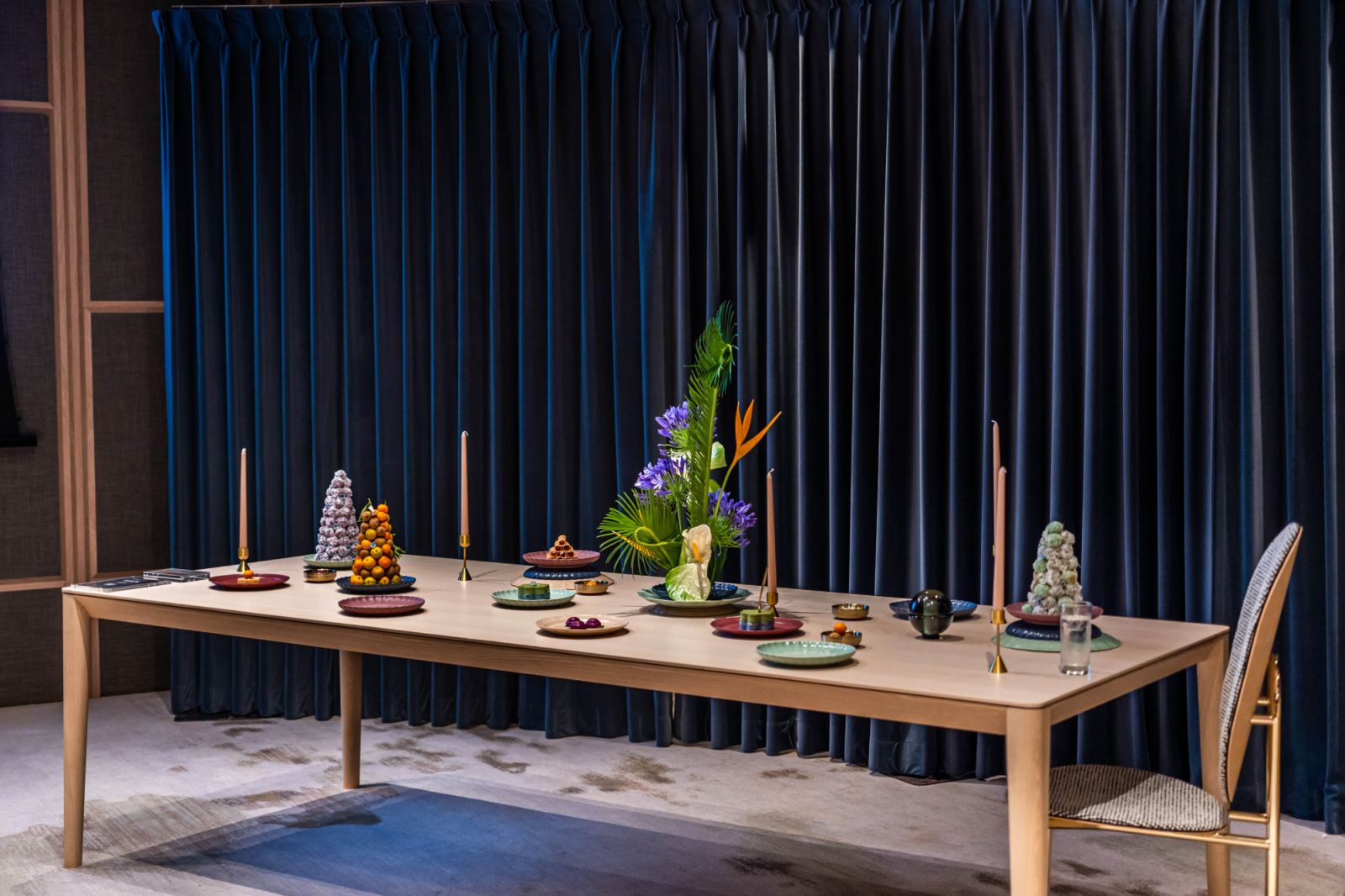 A tablescape featuring Luzerne’s Peranakan collection designed in collaboration with ceramic artist Yen Qin with Coesa curtain as the backdrop