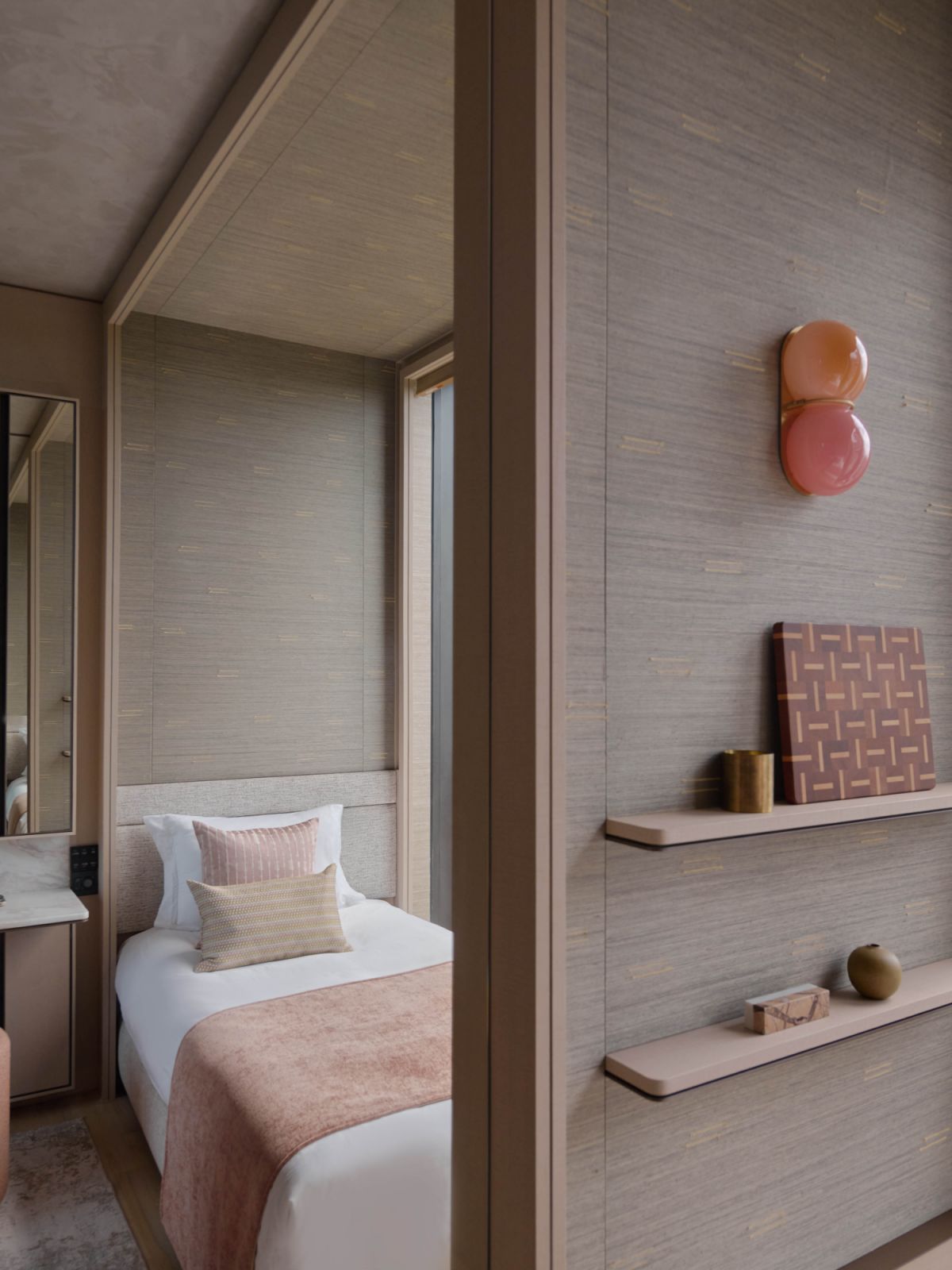 The daughter’s bedroom was given a playful touch through the addition of dual-tone glass sconces from Sklo