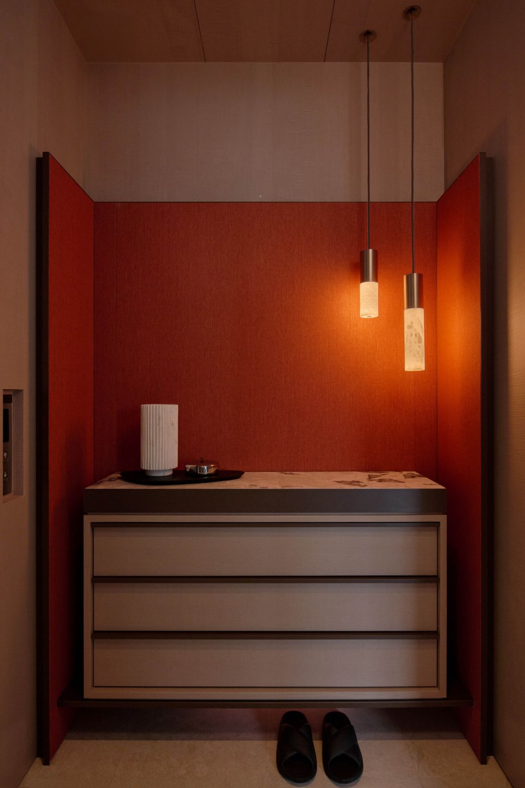 The entryway welcomes homeowners and guests into the apartment with a quiet, soothing ambience