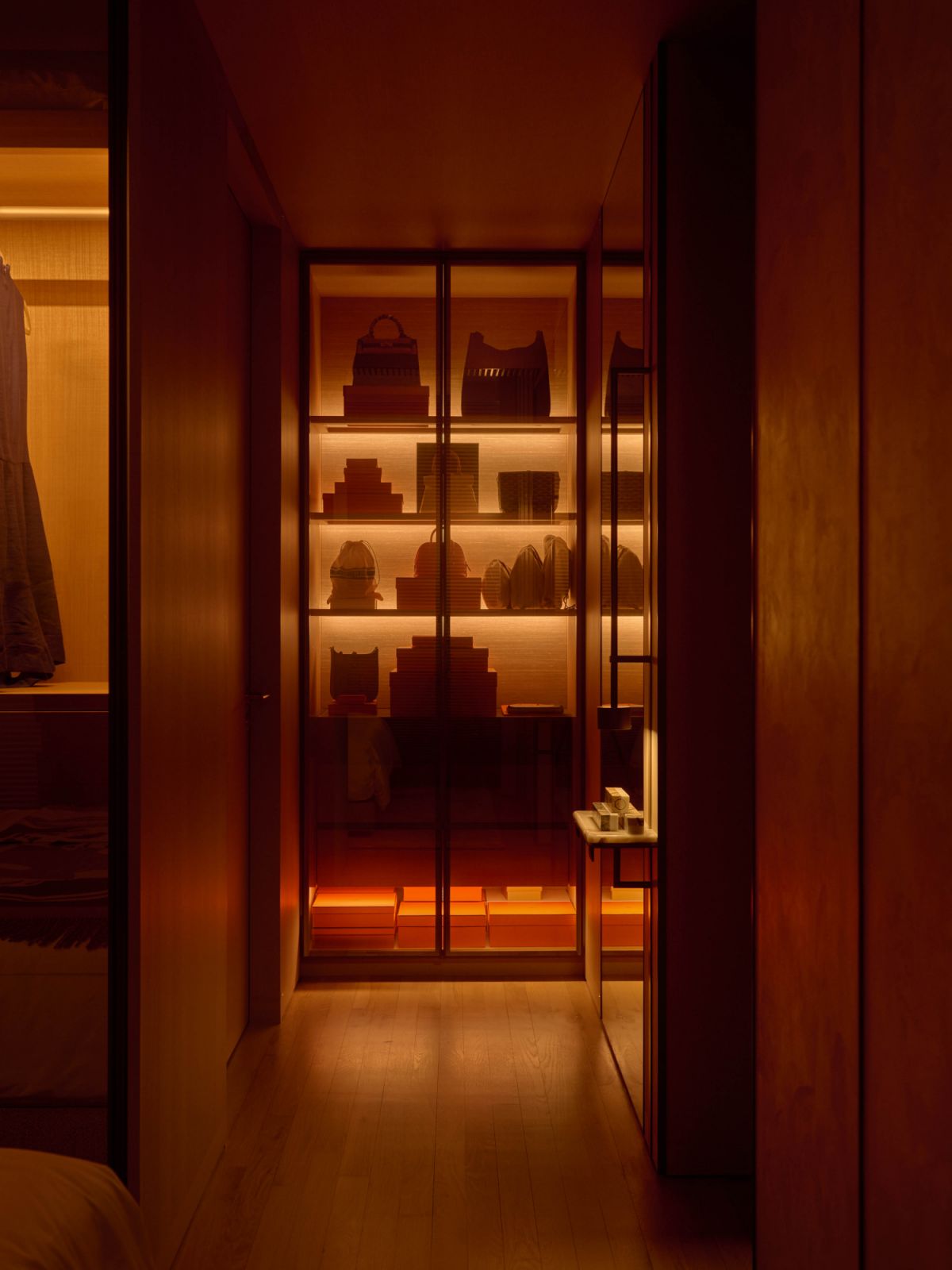 Custom storage for bags balances aesthetics and practicality in the master bedroom