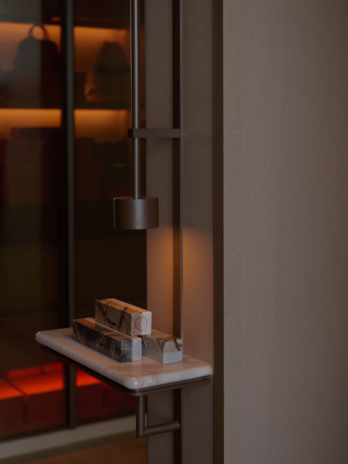Dim, moody lighting keeps the bedroom feeling restful