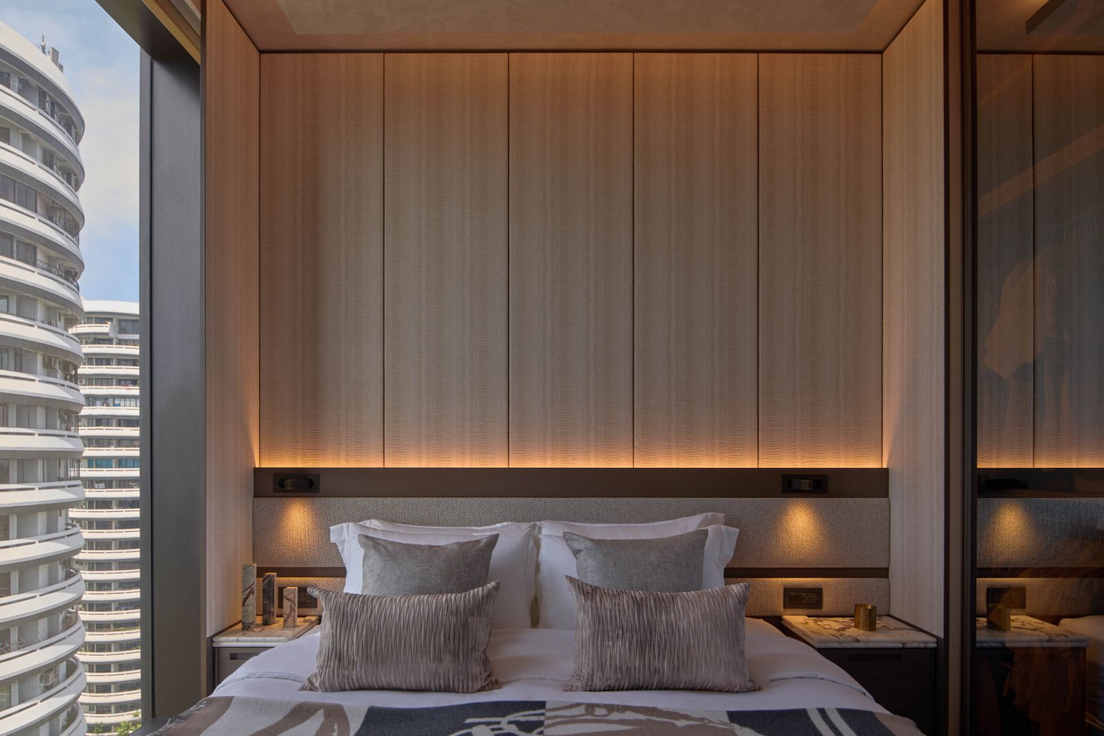 One of the bedrooms in the apartment, with panoramic views of Singapore’s cityscape