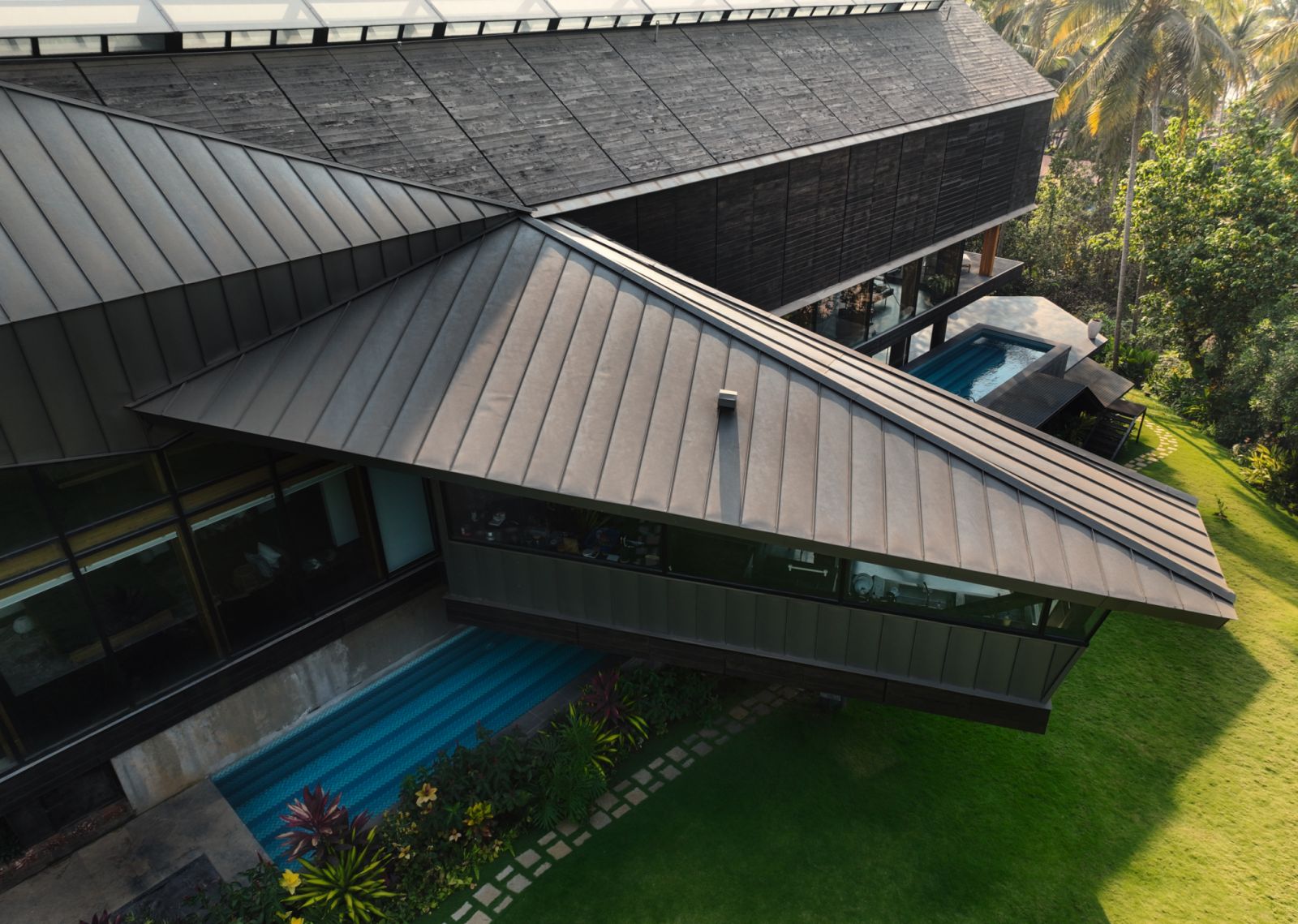 A 25-metre-long rectangular pool runs along the length of the house