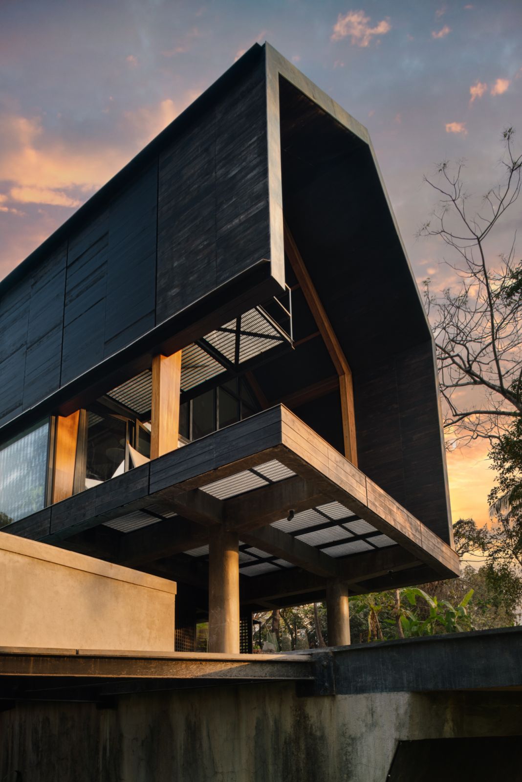 The residence appears to float above the landscape, projecting out towards nature