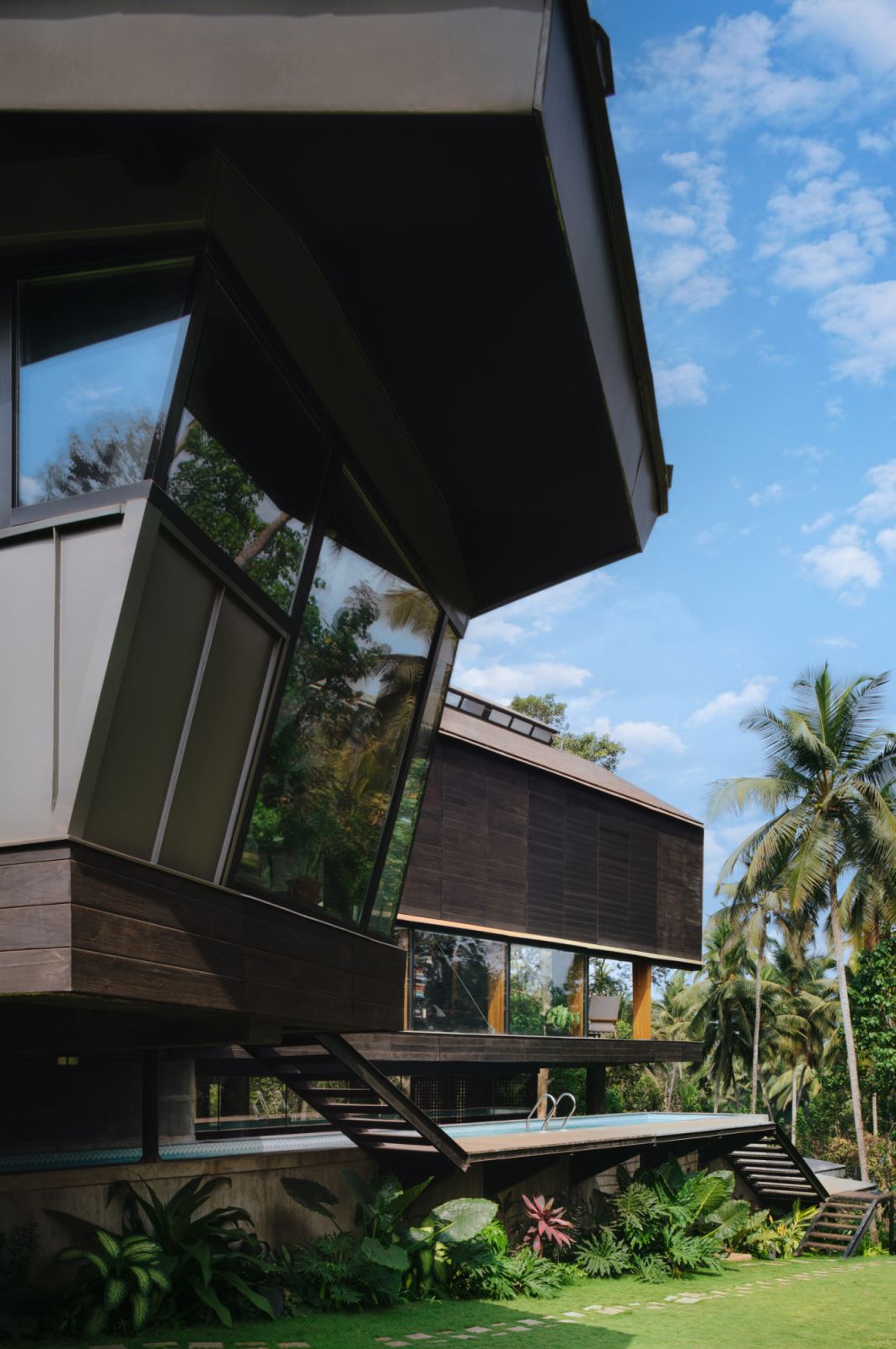 The charcoal grey façade maintains visual harmony with the landscape