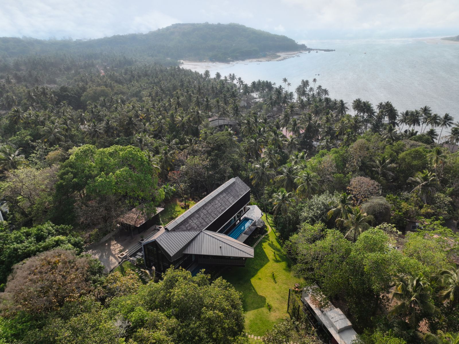 The expansive residence amidst Goa’s tropical landscape, overlooking the Chapora River and the Arabian Sea