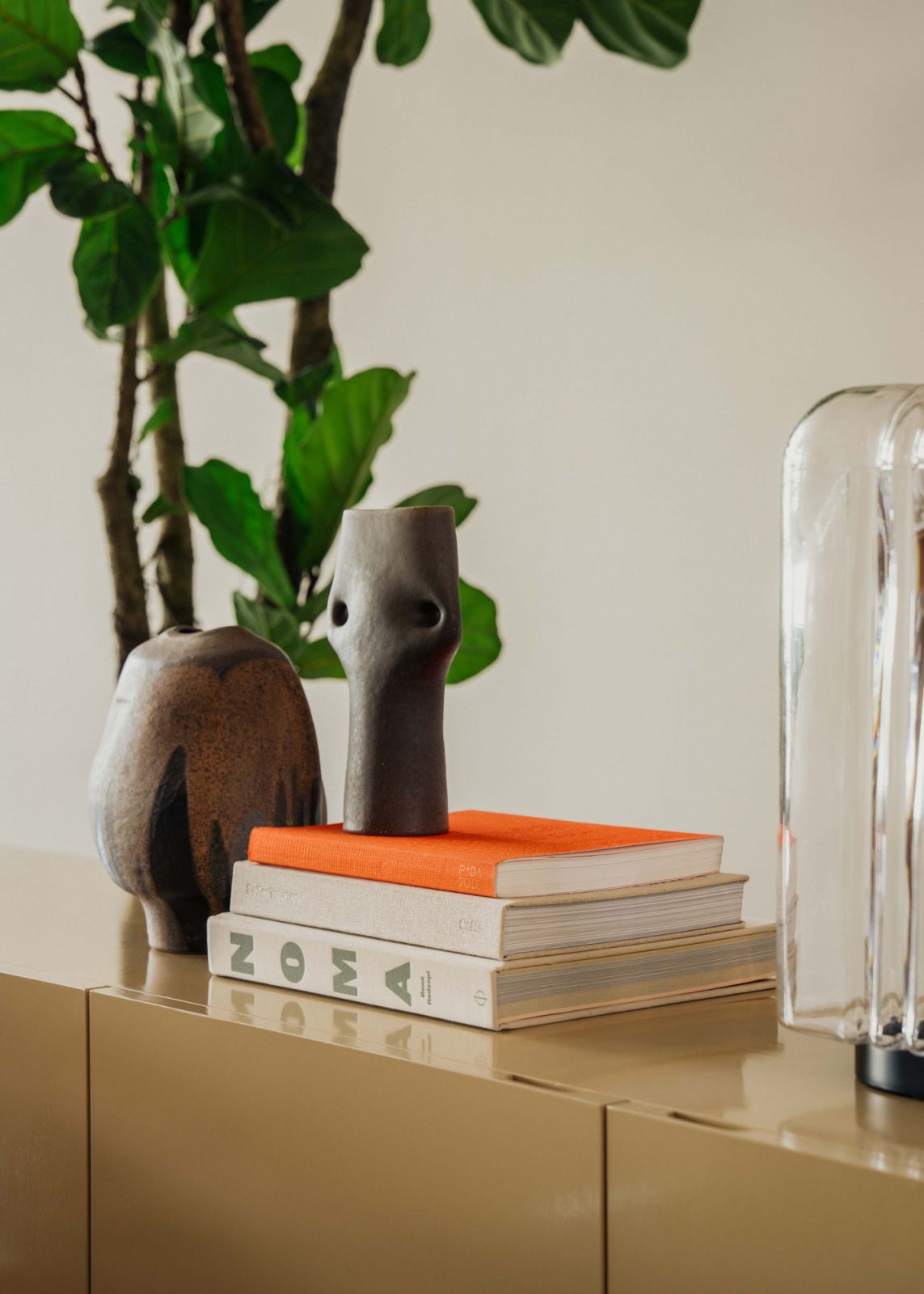 Curated accessories in one corner add a lived-in touch