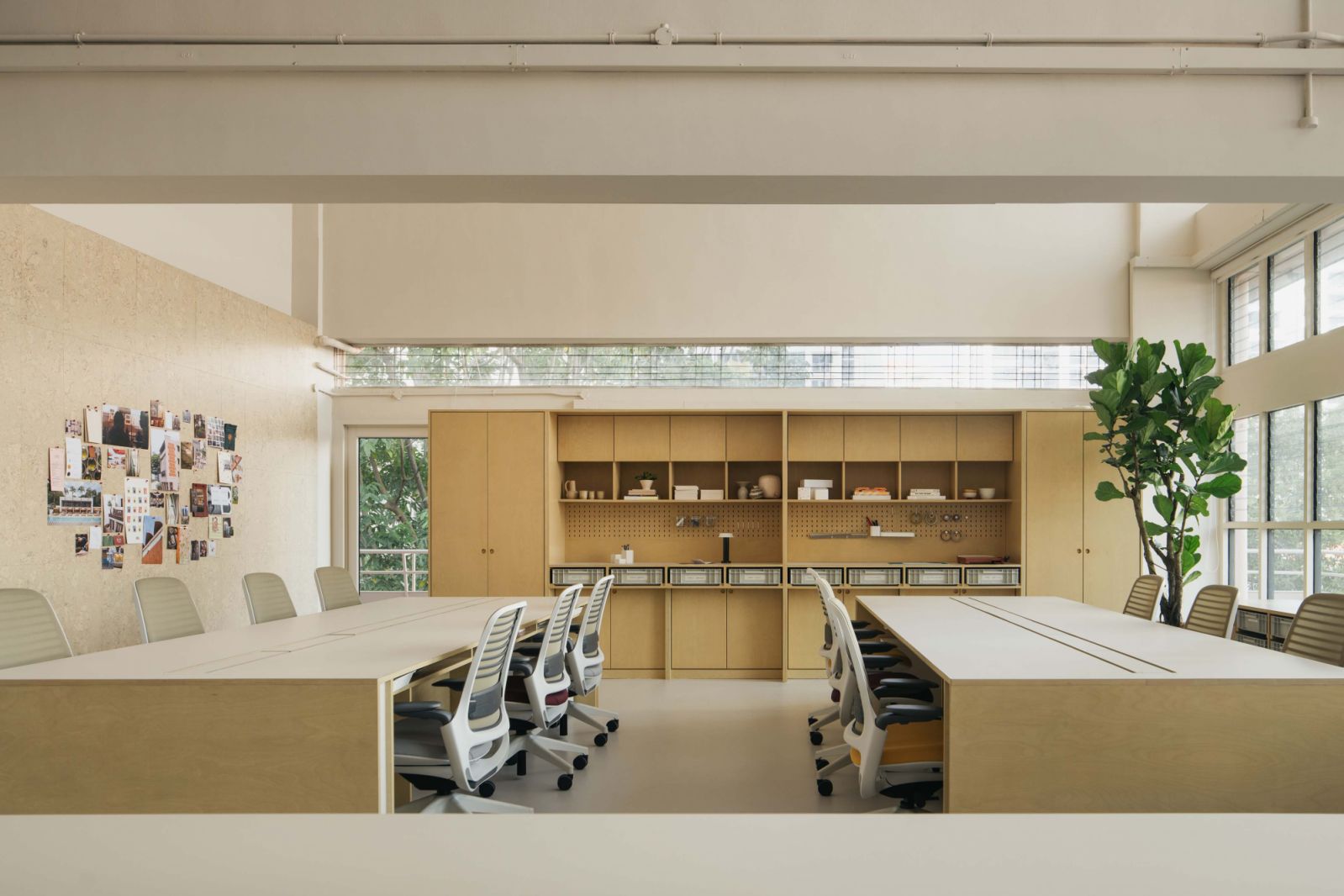 The Lo & Behold Group’s main office area features Steelcase chairs and custom work tables for hot-desking