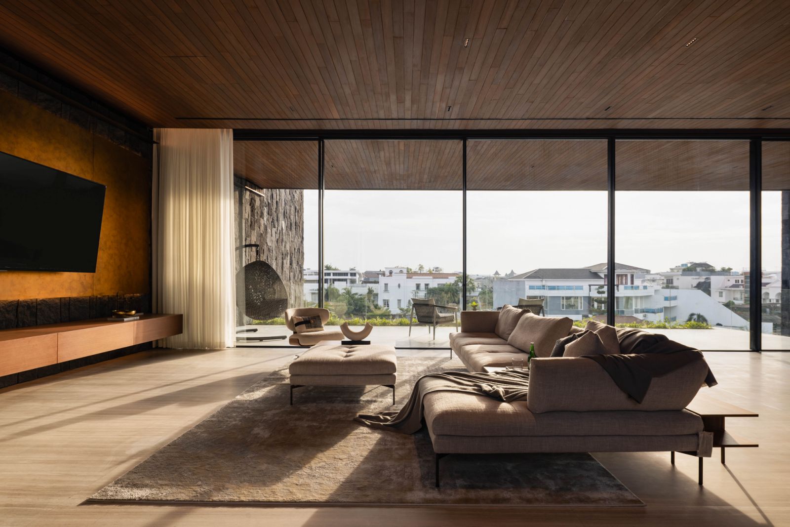 The lofty height of each level is proportionate to the home’s width, as shown in this living room