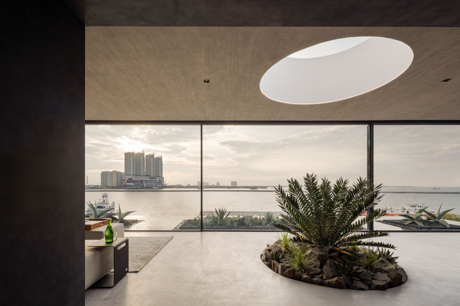 The top-floor lounge features a cooling pool and panoramic waterfront vistas
