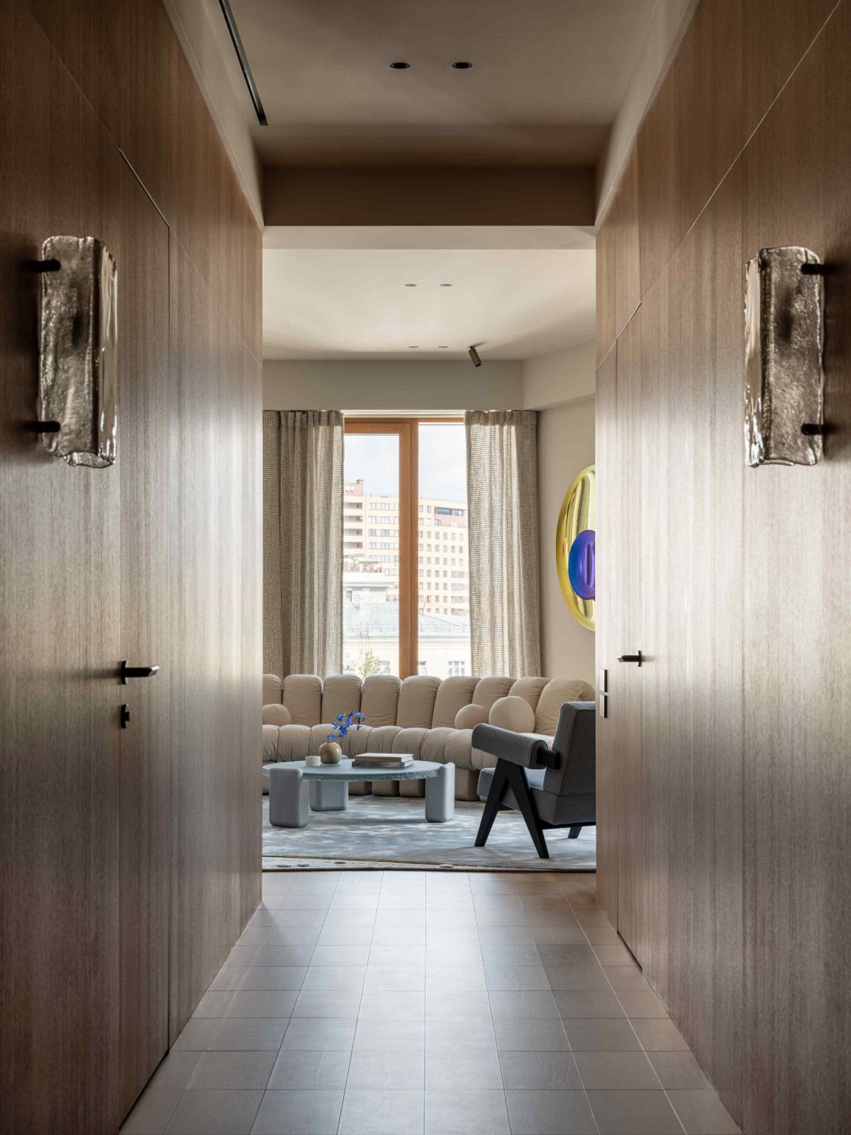 This wood-panelled hallway provides clear delineation between the public and private areas of the home