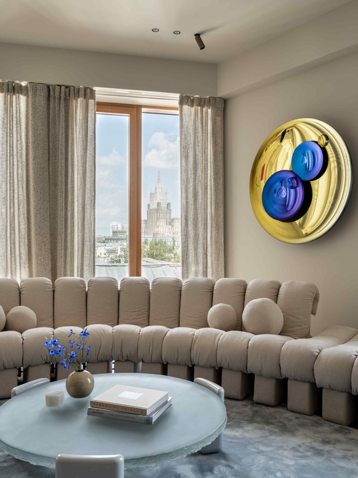 The modular DS-600 sofa from de Sede, a custom-designed coffee table with a Fresh.Glass top, and Christophe Gaignon’s Art Mirror