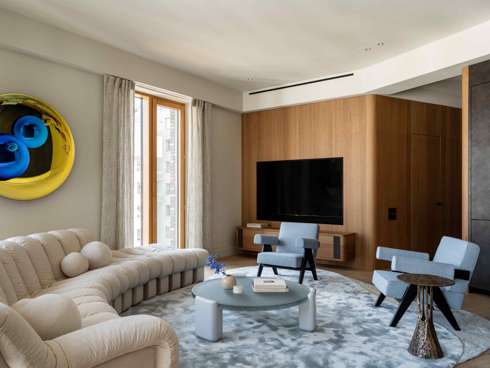 The ceilings are painted to match the wall coverings, creating a cocoon-like atmosphere