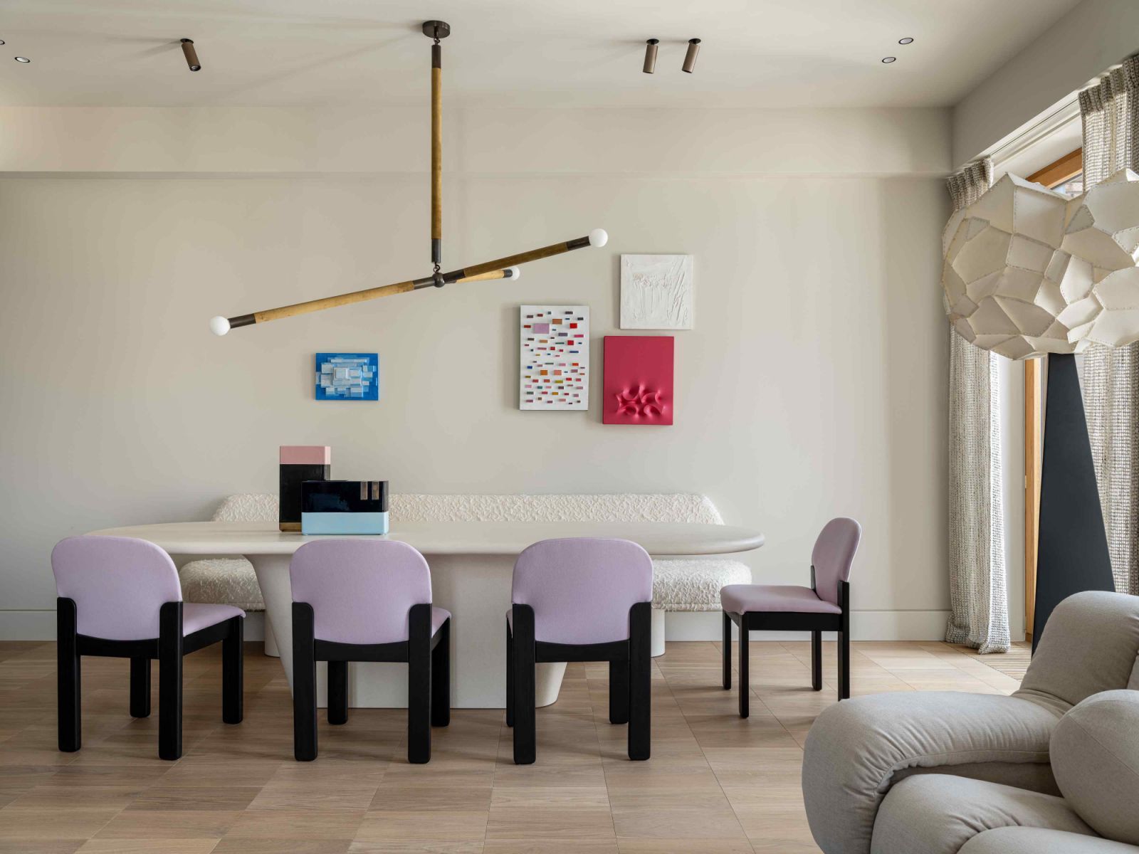 The whimsical dining area with vintage dining chairs by Ernesto Radaelli reupholstered in gentle lavender wool