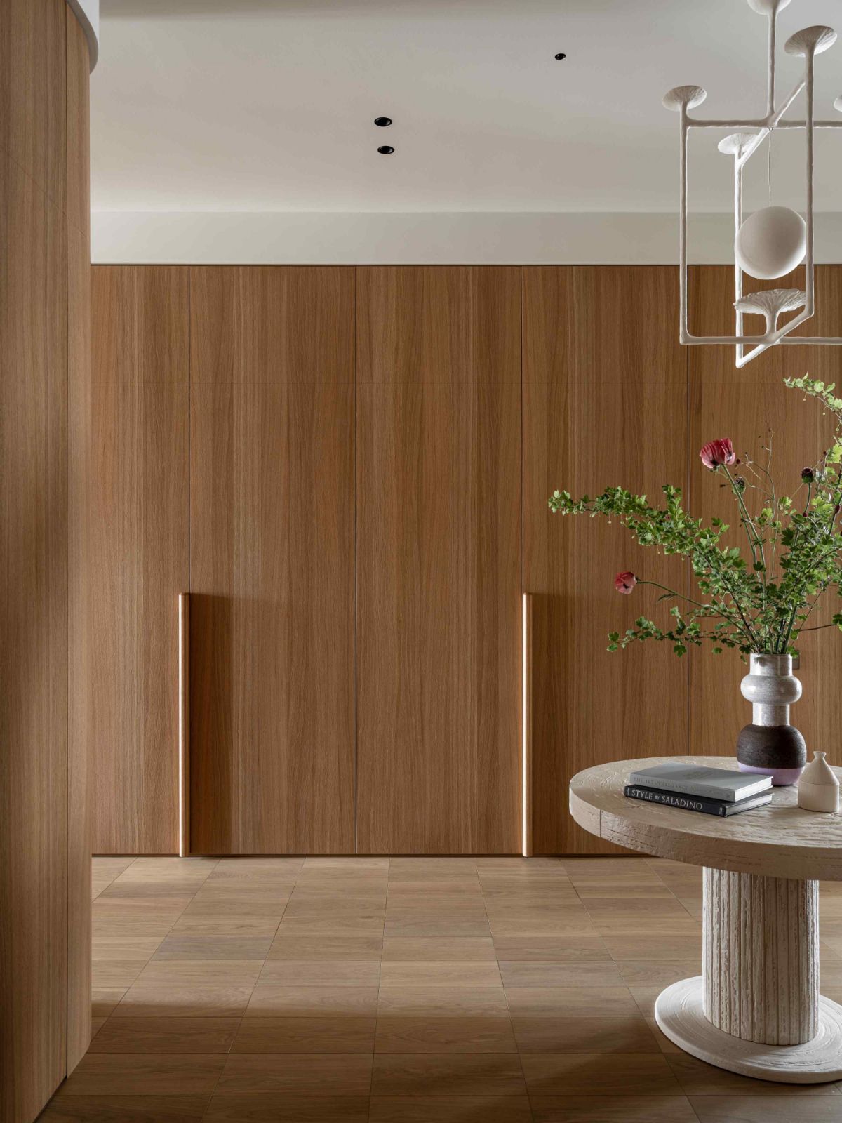 The veneered oak panels in the hallway double as a wardrobe area