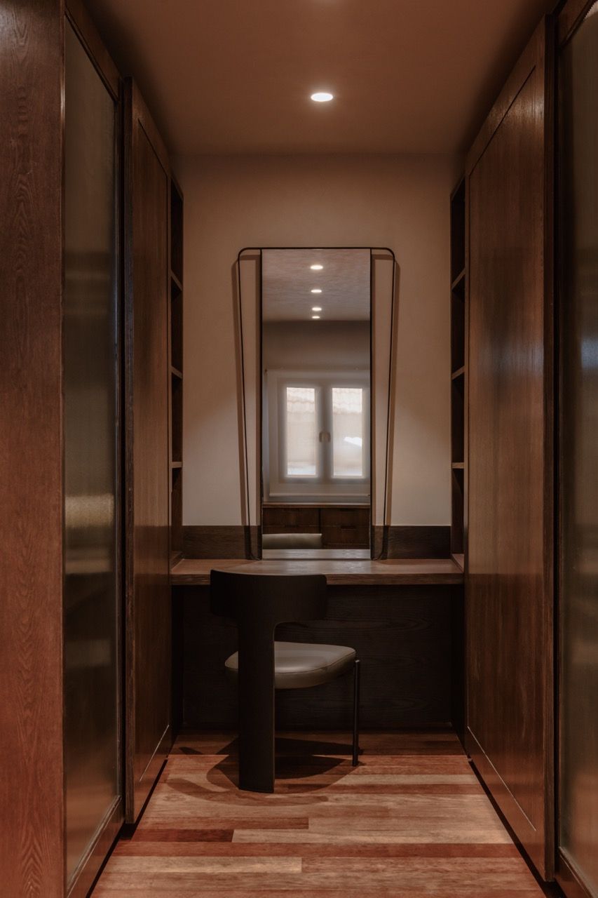 The master bedroom's walk-in wardrobe, created by merging the original bathroom space with the wardrobe to form what Lim describes as a luxurious suite