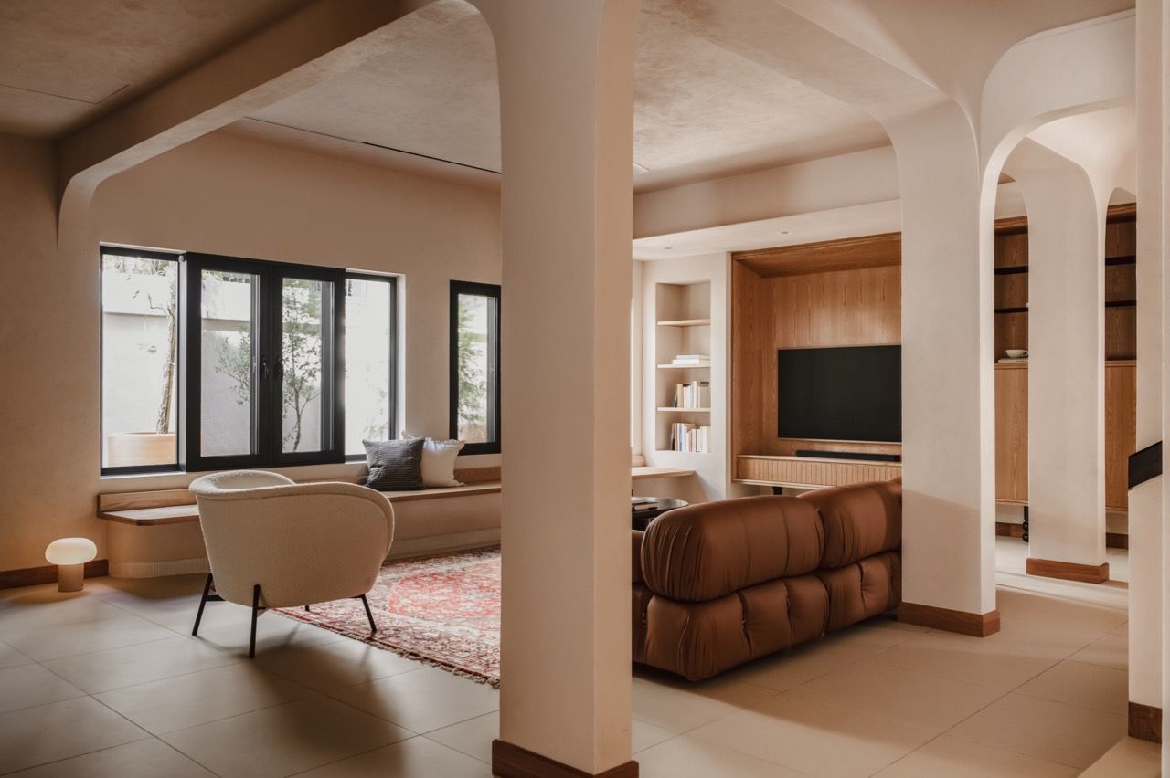 The living area viewed through the arched openings, showing how Lim integrated the troublesome central column into the design rather than removing it