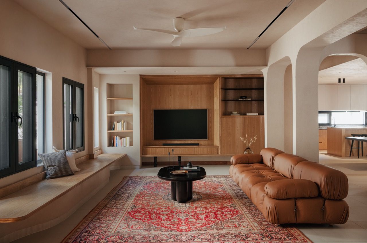 Overview of the main living area showing the low ceiling beams that were once considered problematic but now add character to the space