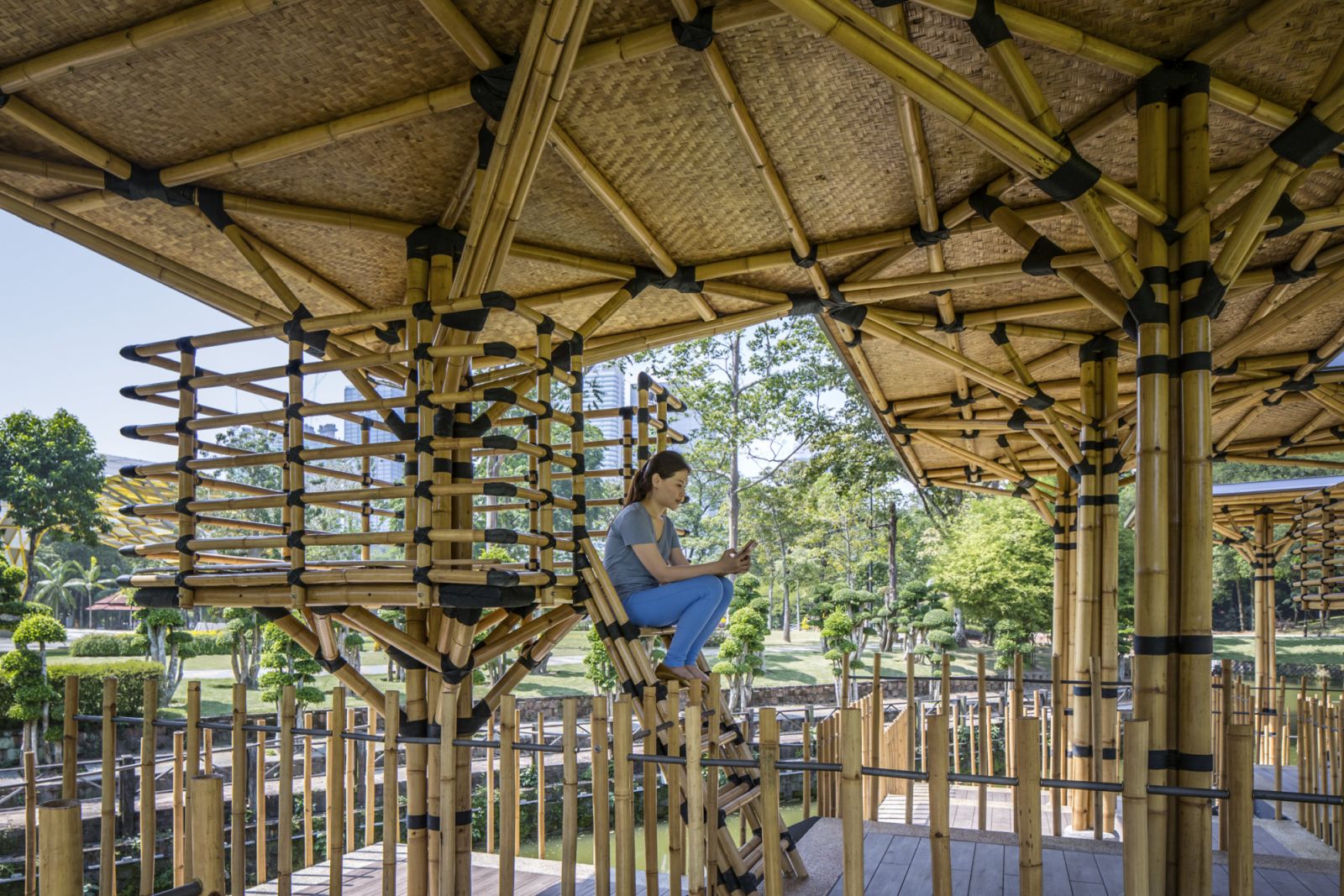 Bamboo Playhouse with woven ceiling panels and modular construction system, showcasing the practice’s expertise in sustainable material applications and community-oriented public spaces that encourage social interaction.