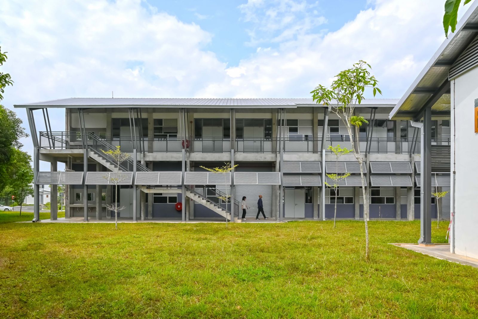 Kolej Vokasional Juasseh is a multi-storey educational building with external circulation galleries and solar panels, showing EJA’s commitment to sustainable institutional architecture that promotes natural ventilation and community interaction through shared external spaces
