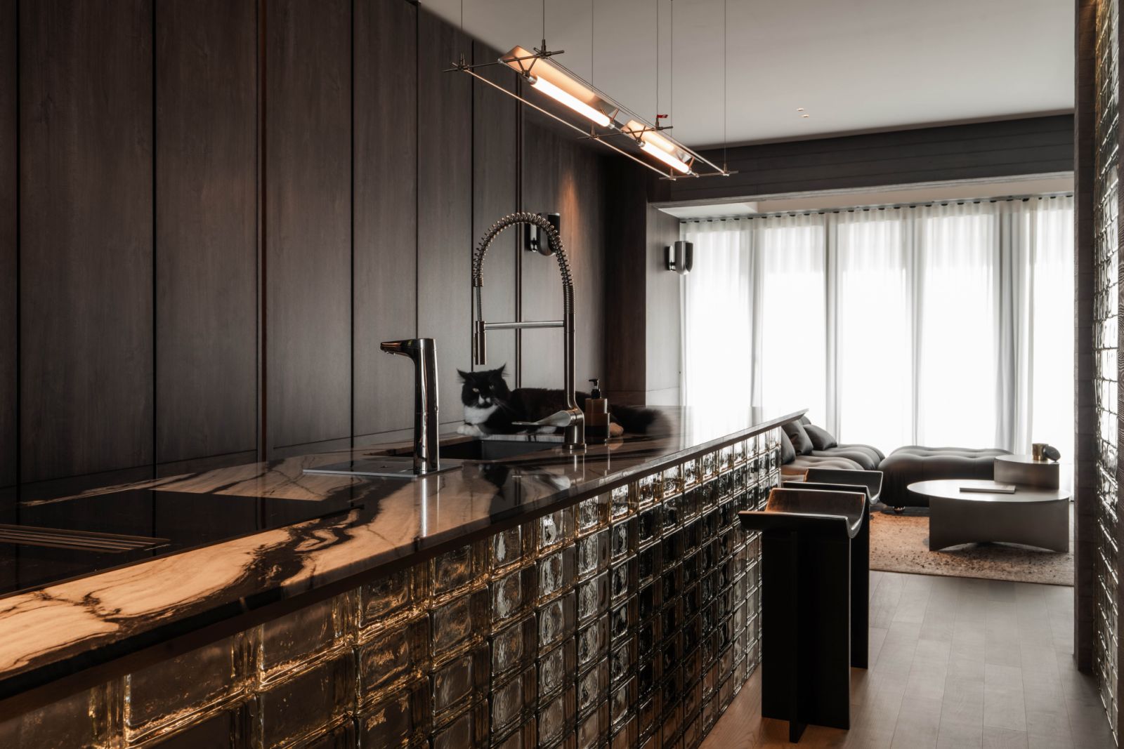 The handsomely styled kitchen is the resident tuxedo cat’s favourite hangout