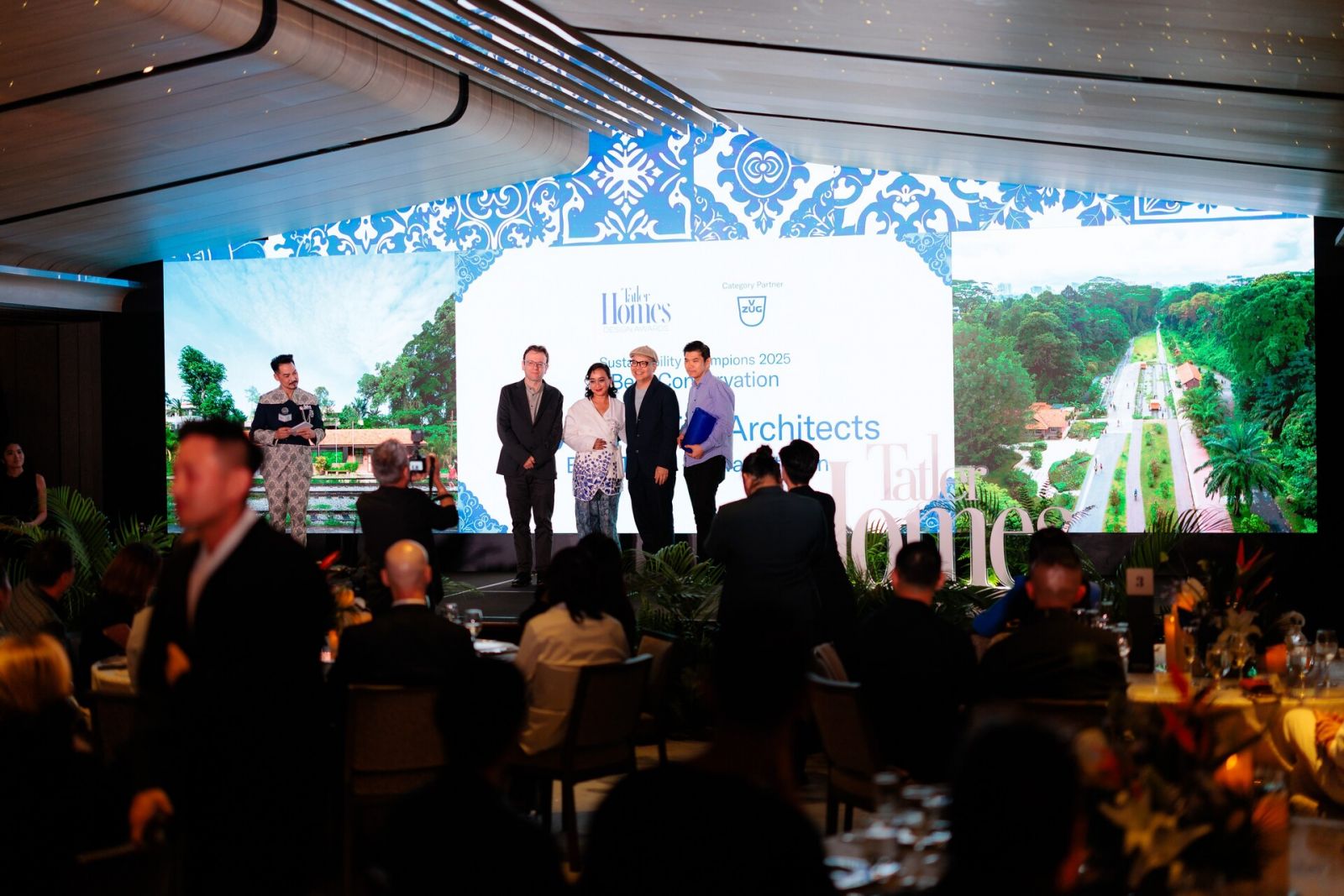 Kay Ngee Tan and collaborators on stage for the Sustainability Champion award