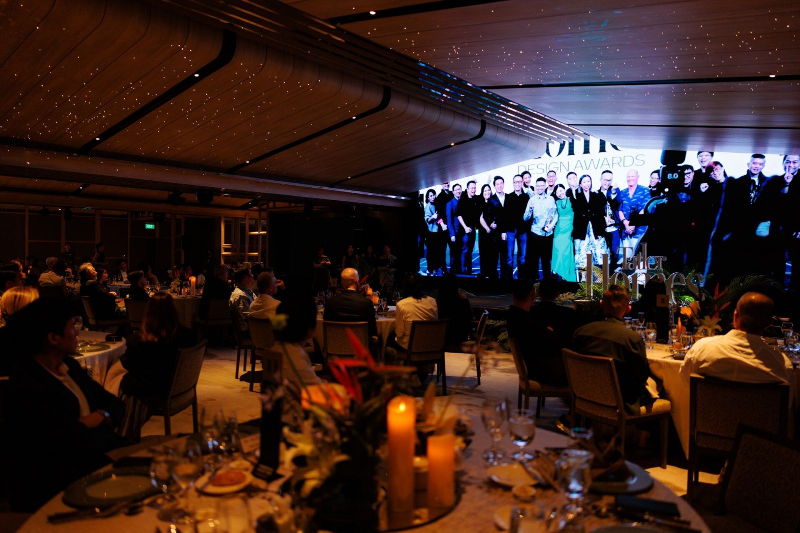 A 20th year anniversary video of Tatler Homes Singapore playing on screen