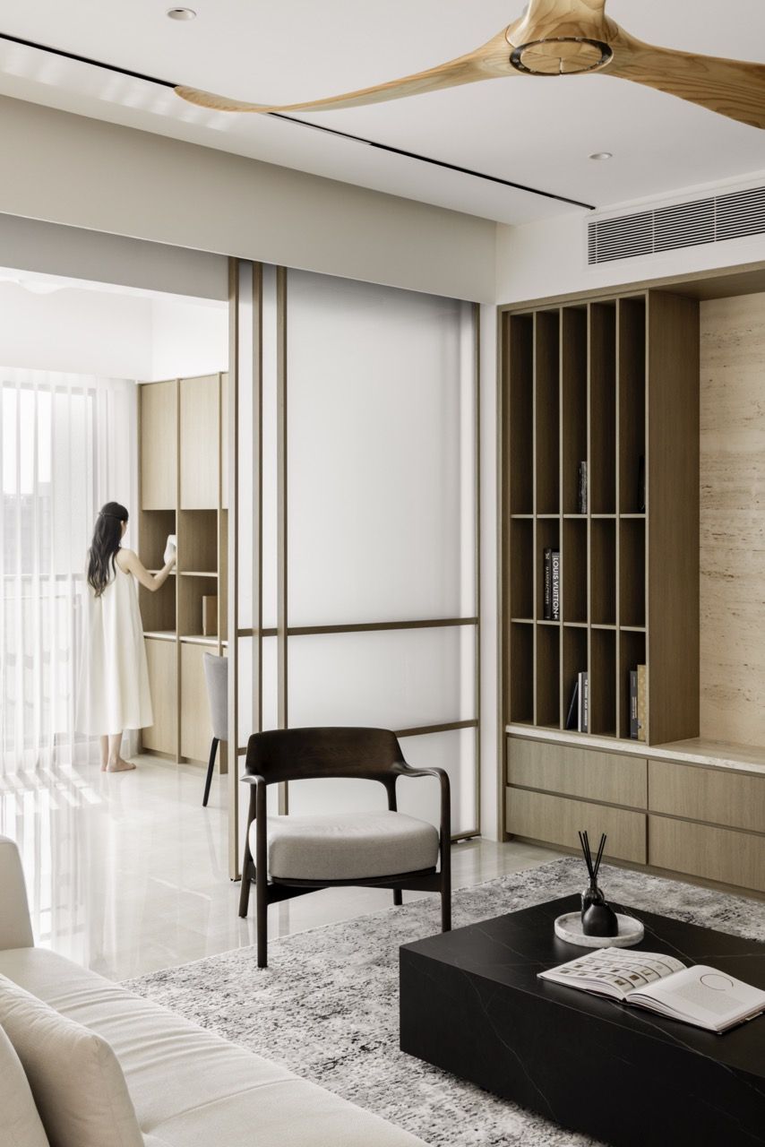Spaces benefit from natural light while maintaining the apartment’s consistent material palette
