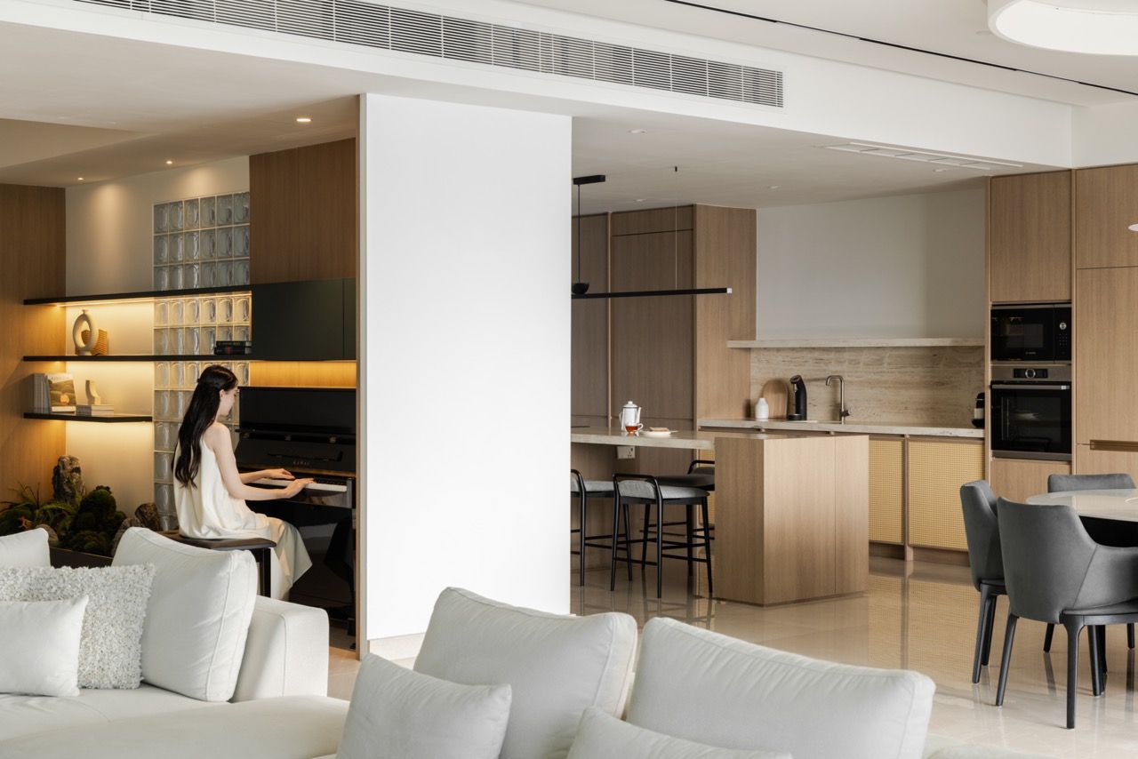 The open layout allows sightlines across different zones while maintaining visual cohesion through consistent materials