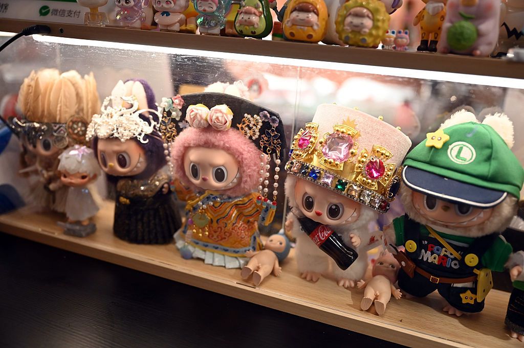 Labubus in China
03 July 2025, China, Peking: Several Labubu figures from the Chinese brand Pop Mart are displayed in a showcase on a bar counter. The figures have individual clothing that is now available online, for example. Photo: Johannes Neudecker/dpa (Photo by Johannes Neudecker/picture alliance via Getty Images)