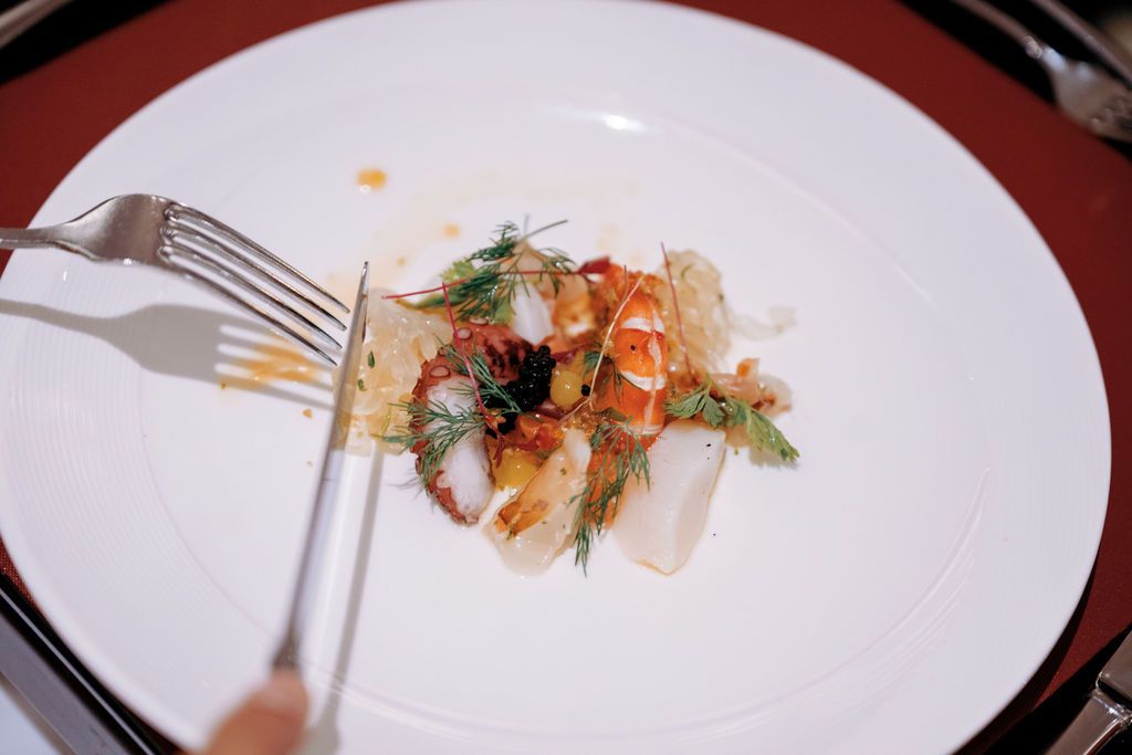 Seafood ceviche: prawn scallop, cured salmon, tako marinated with chilli lime dressing and lychee pomelo salsa