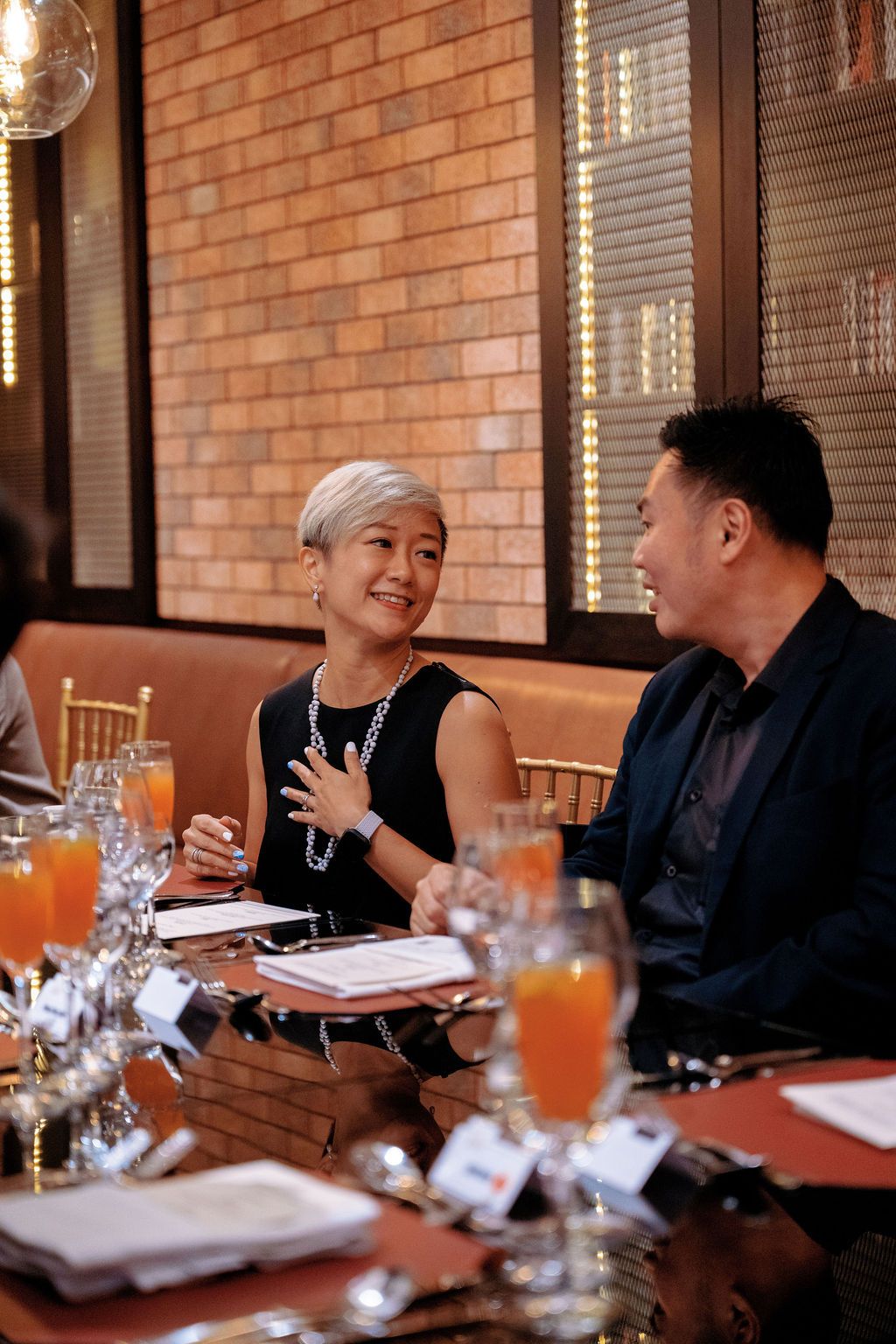 Lim Xin Yu, co-founder of The Asli Co speaking with Steven Ng, founder and director of Geomax Rubber Innovative Products