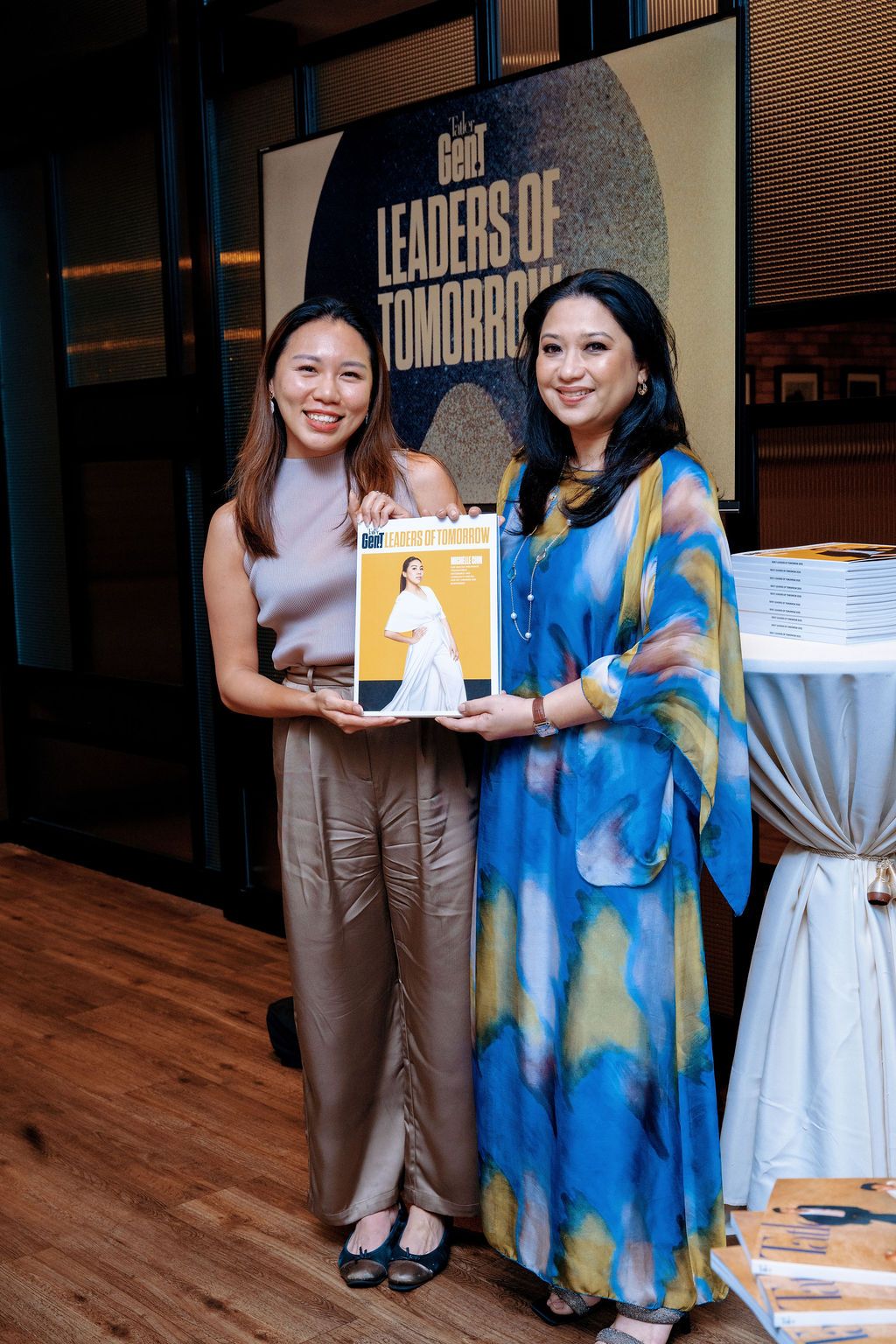 Suraya Rahmat, general manager of commercial at Tatler Malaysia presenting Michelle Chin with her personalised copy of the July 2025 issue, featuring her Gen.T profile image
