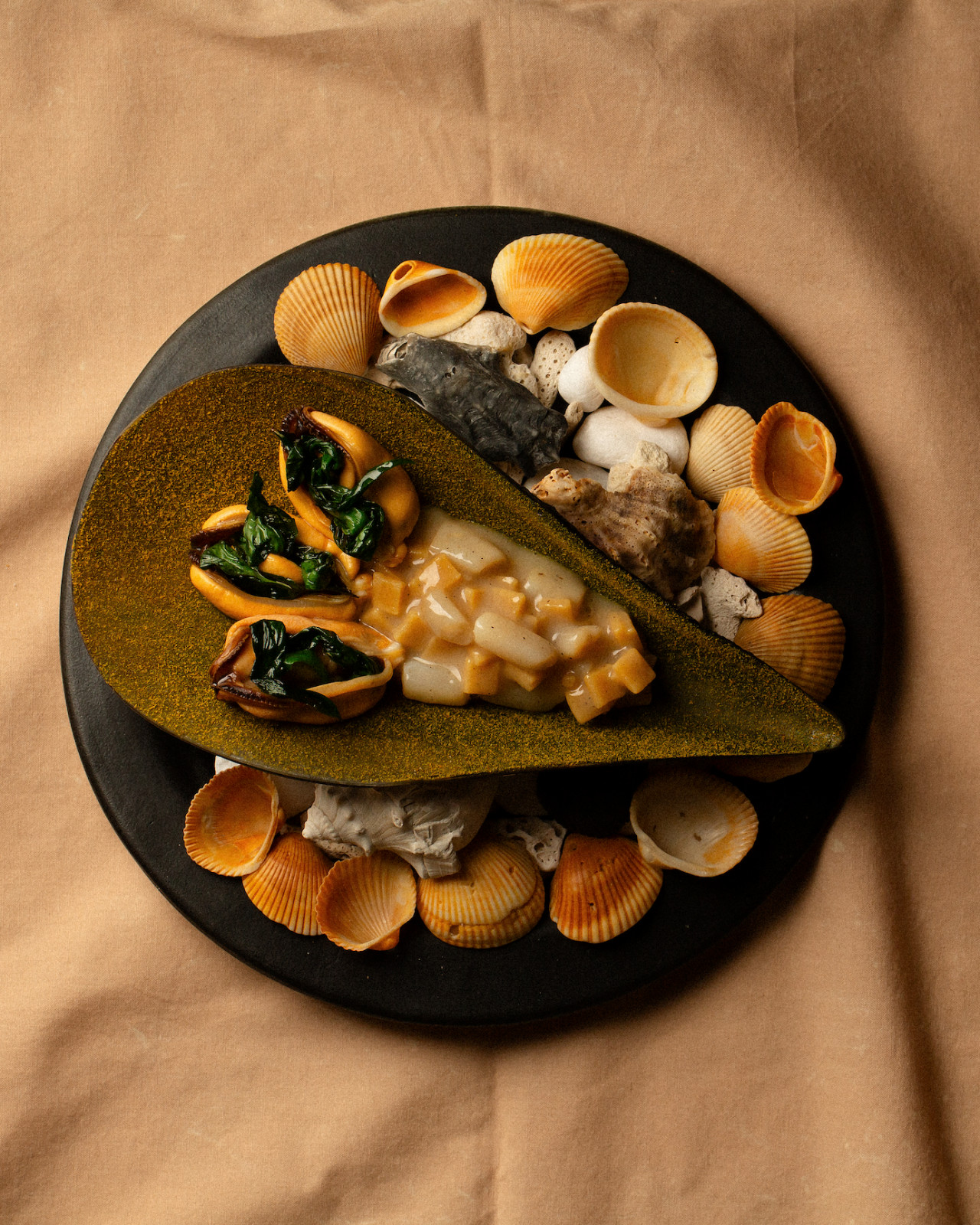 Mussels and razor clams in koji milk with wild garlic, squid garum, and a revitalised ancient Roman fermented fish sauce (Photo: Somma) best fermentation restaurant chef singapore