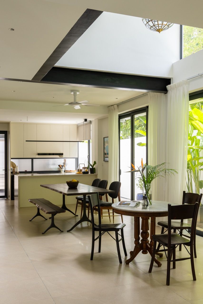 The extended living spaces flow seamlessly between kitchen, dining, and lounge area