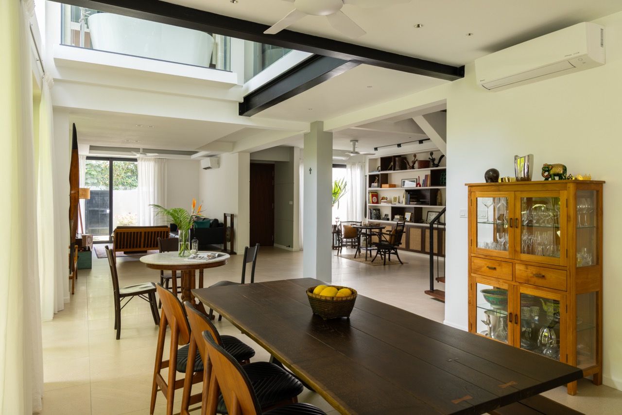The open-plan kitchen and dining area showcase the successful extension of the original terrace house, with the cooking island and dining table accommodating the family's frequent entertaining