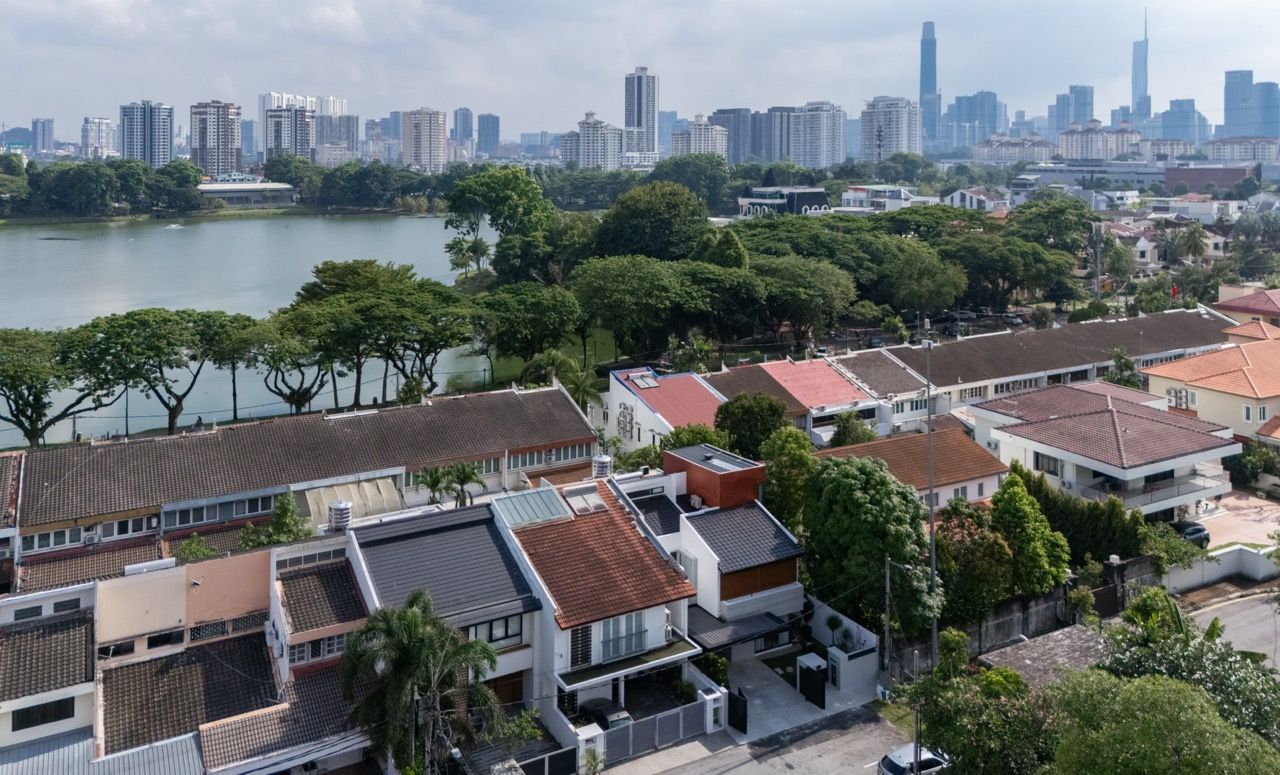 The panoramic view from the converted mezzanine floor showcases the Kuala Lumpur city skyline that convinced the architects to pursue this third-floor addition