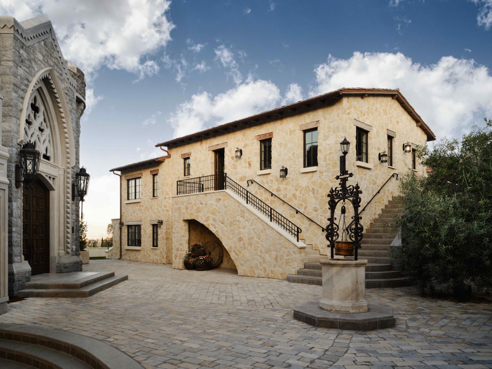 A 300-year-old Portuguese millwheel, and a 350-year-old wishing well from a palace in Portugal in the courtyard