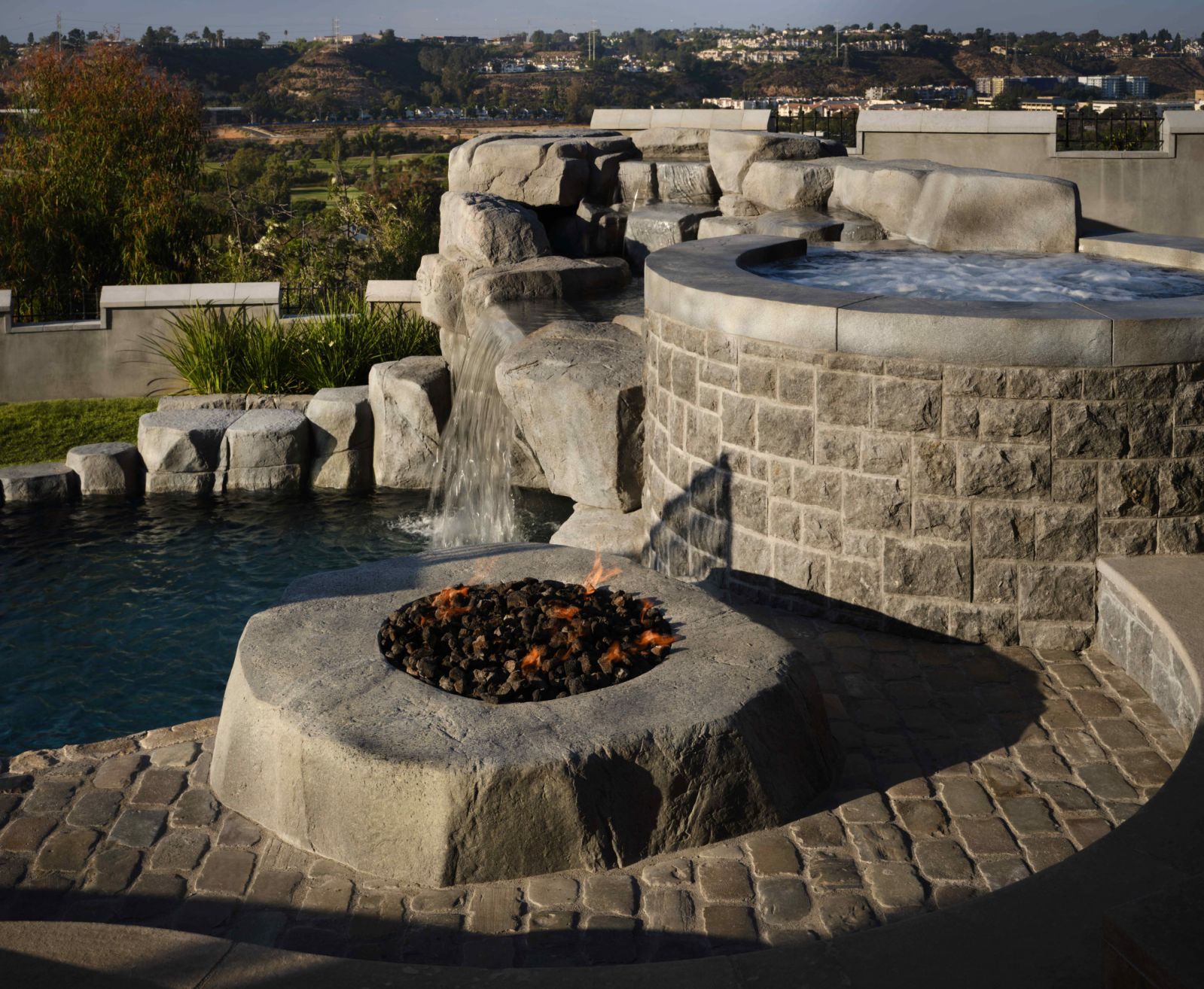 The outdoor area also features a fire pit and a jacuzzi